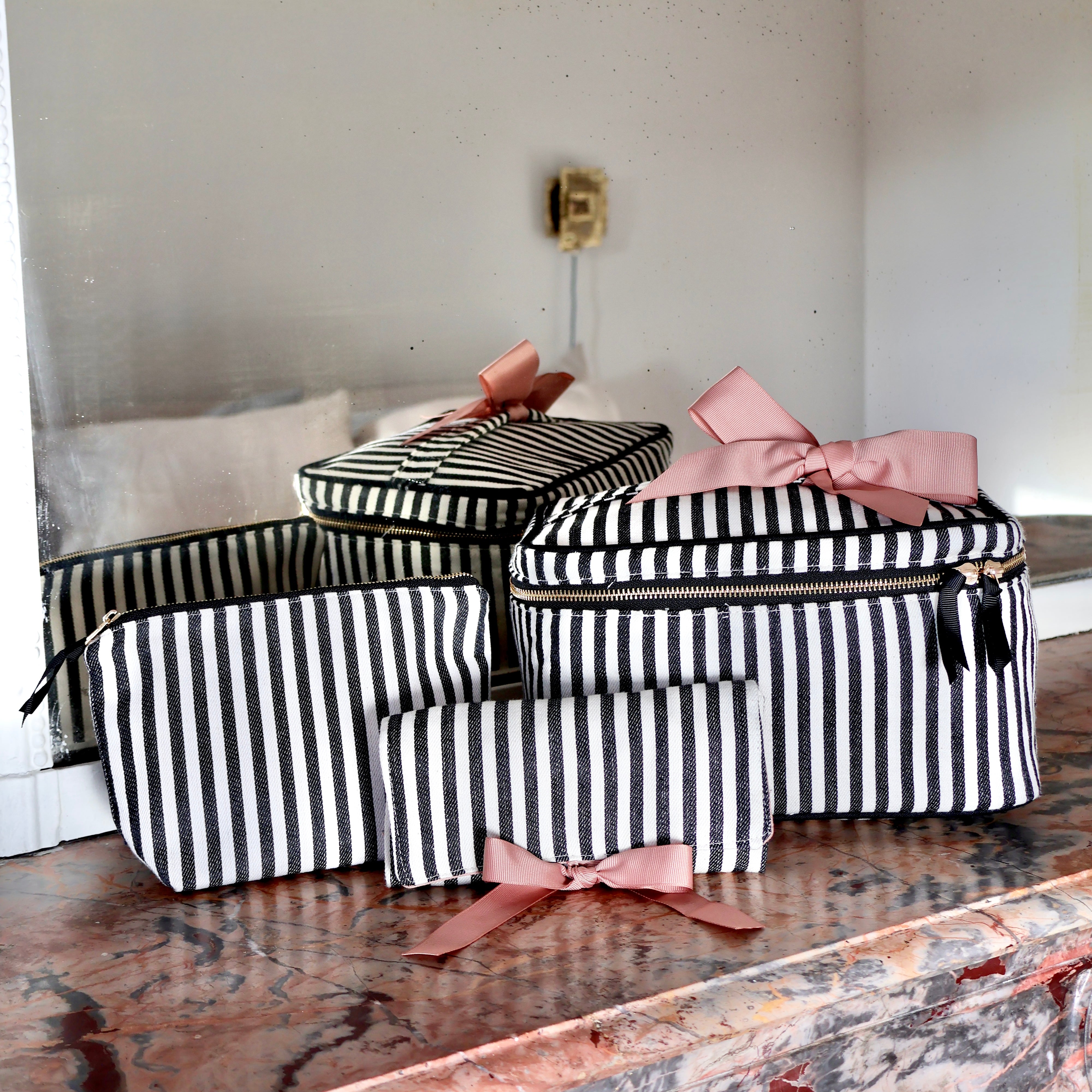 Bag-all striped 3-pack travel and makeup organizers with pink bows, stylish and functional for everyday use.