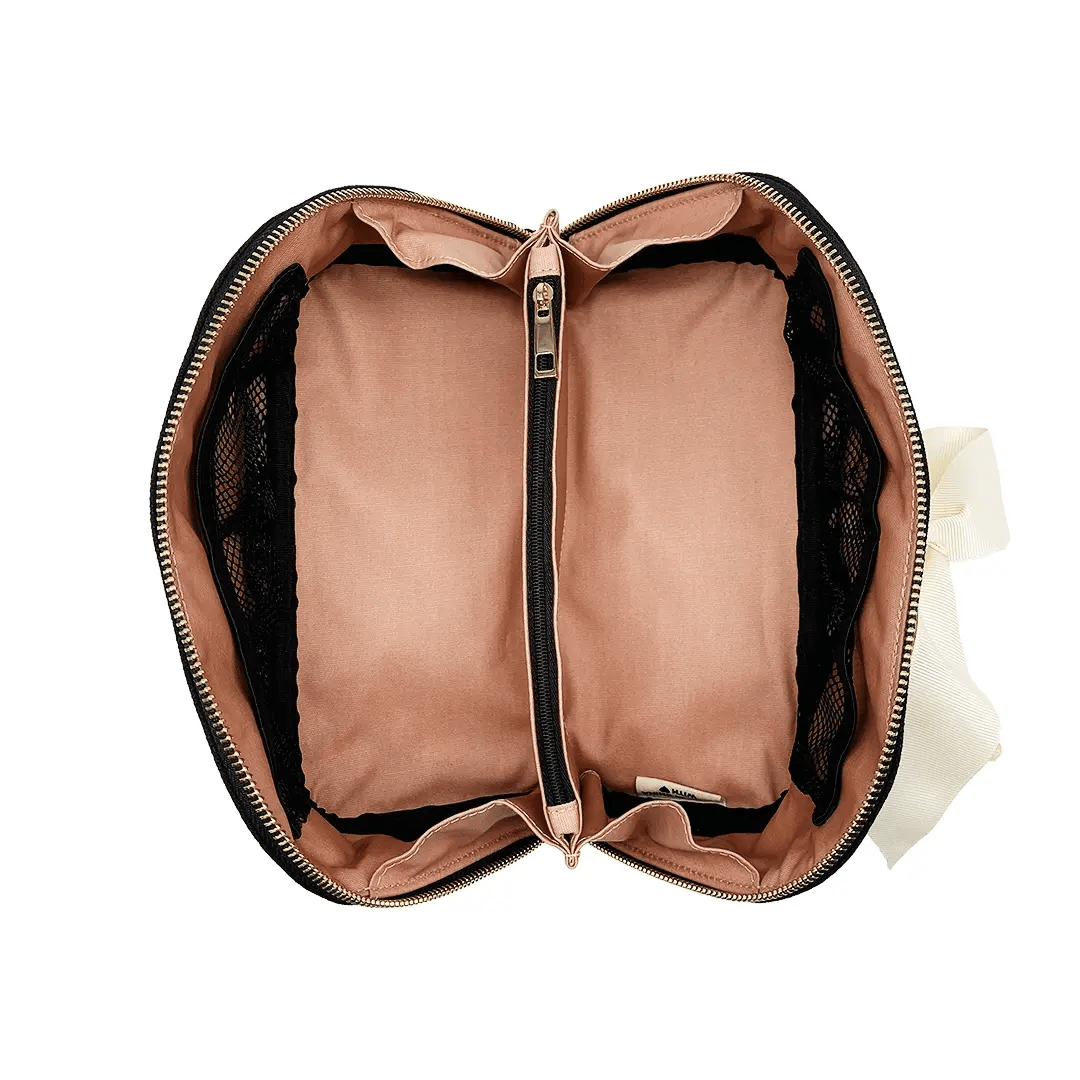 Bag-all organizer case interior view featuring dusty pink lining, central zipper divider, and mesh pockets, perfect for travel essentials and daily organization
