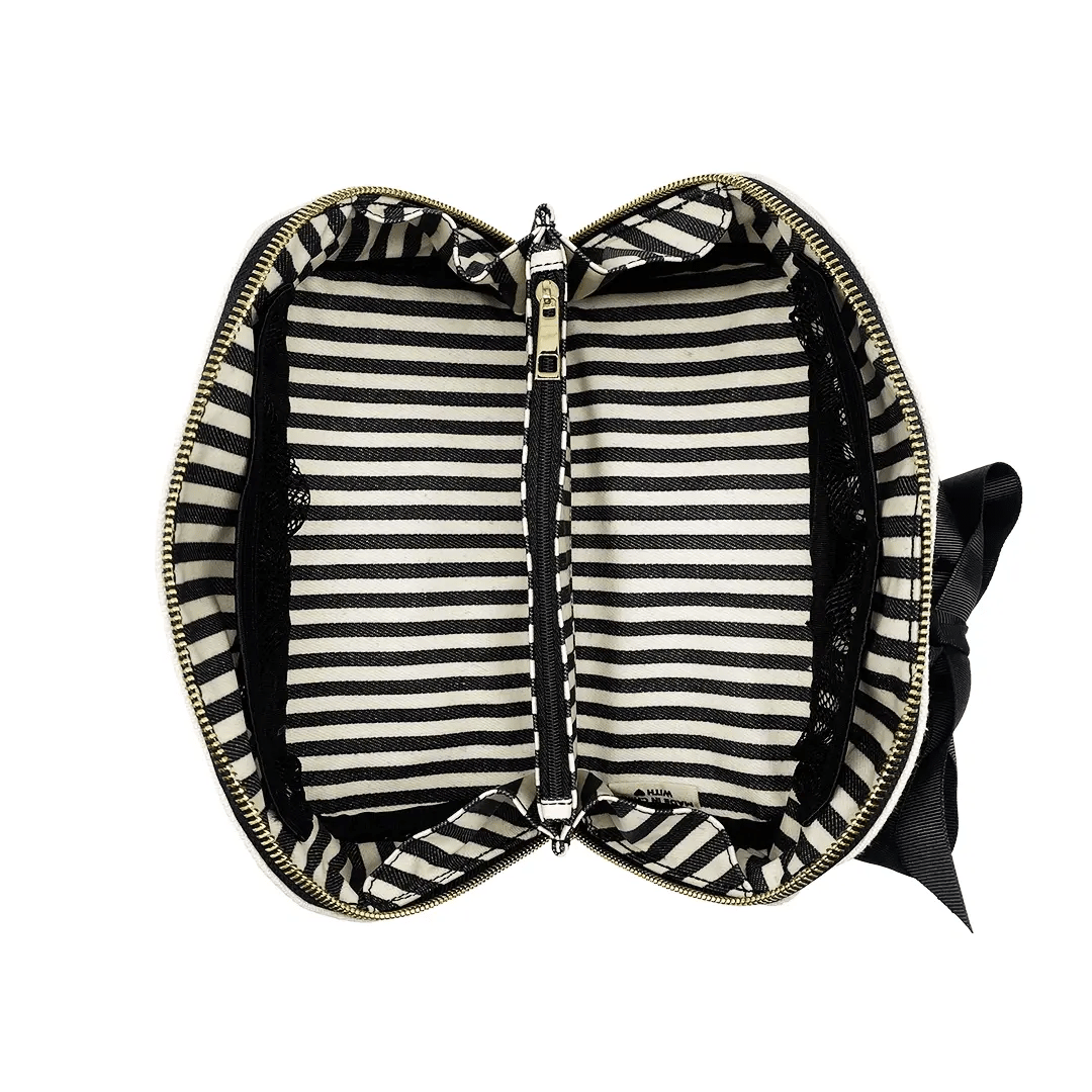 Bag-all black and white striped interior organizer with gold zipper detail, featuring classic nautical pattern lining and bow accent