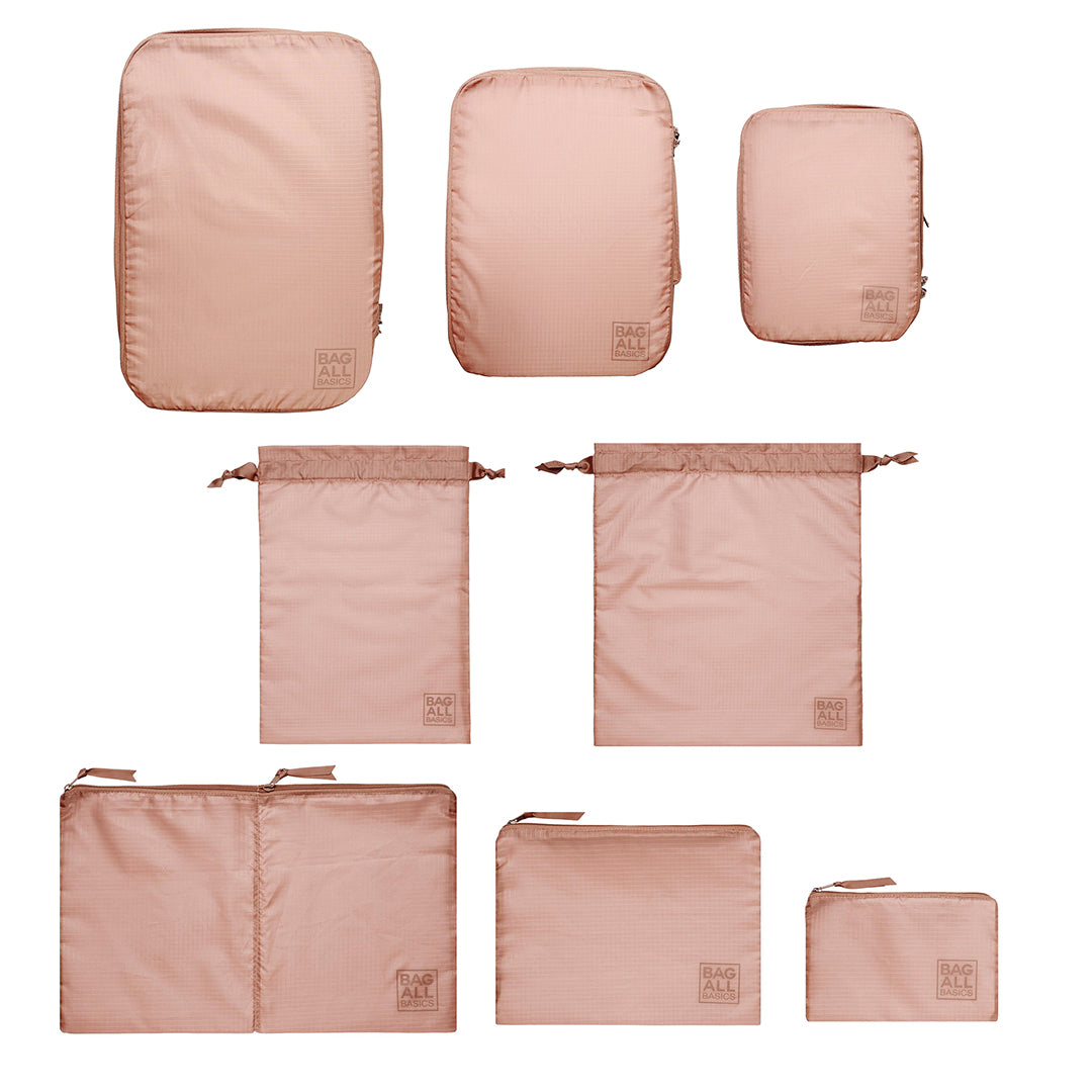 Bag-all Compression Cubes & Packing Bags Set in pink/blush featuring 8 recycled nylon organizers in various sizes for efficient travel packing and storage optimization