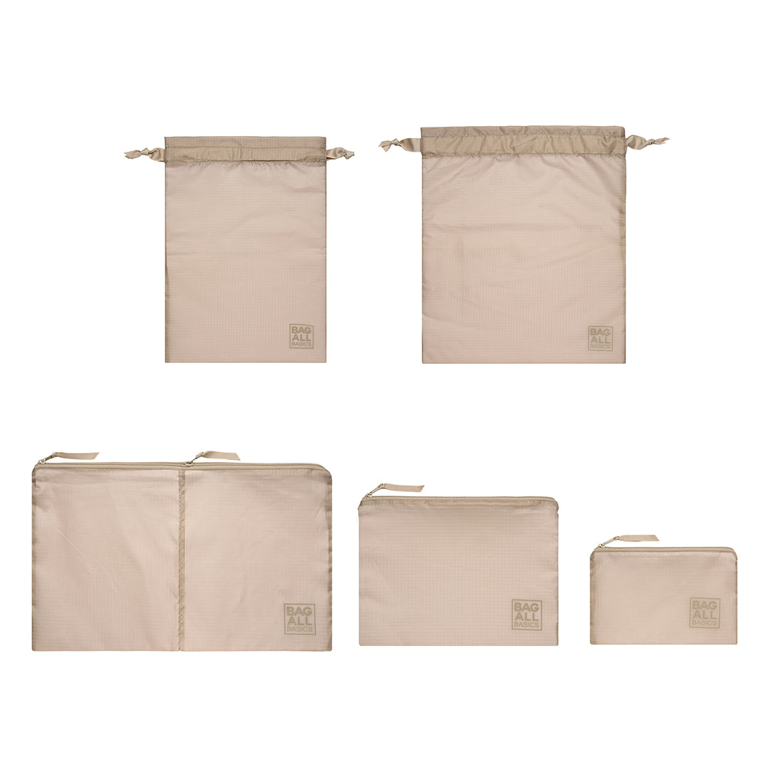 Bag-all Packing Bags Set in recycled nylon featuring 5 taupe organizing bags in various sizes, including double compartment case, ideal for travel and sustainable storage solutions.