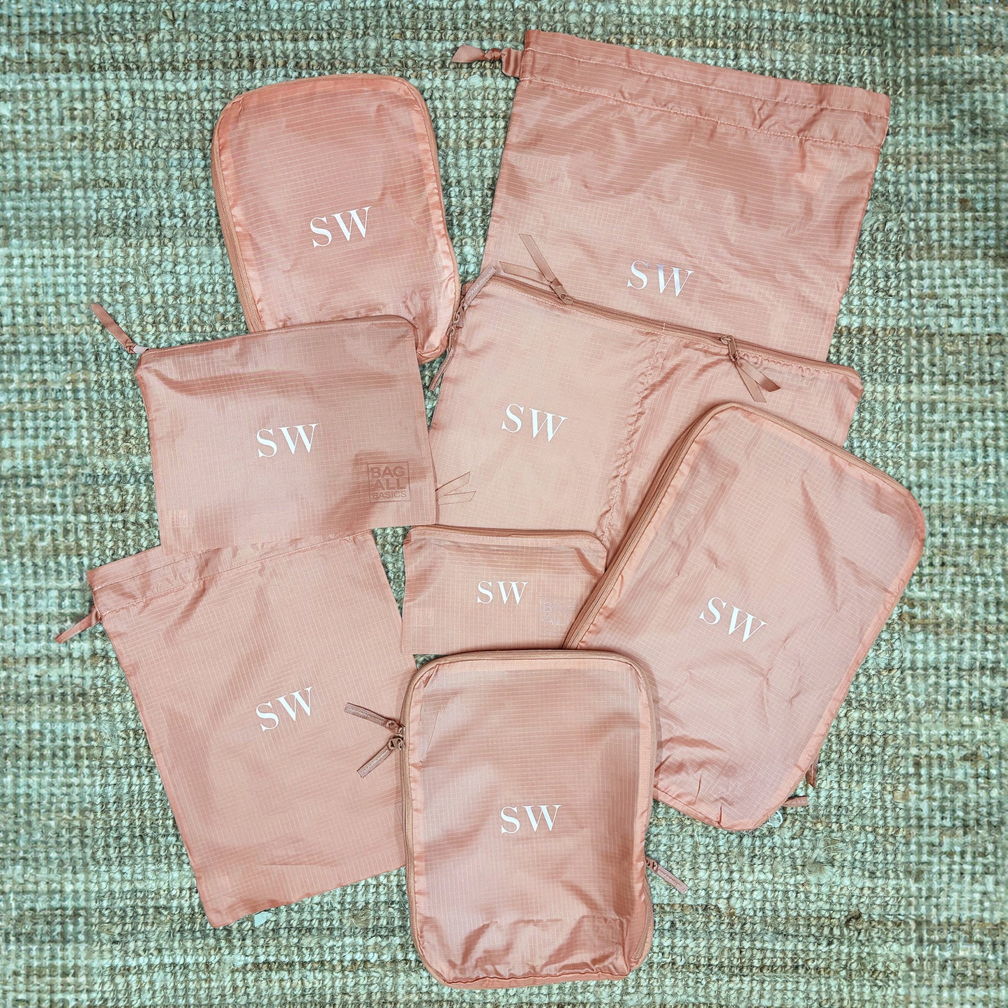 Bag-all Compression Cubes & Packing Bags Set in pink/blush with monogrammed SW initials, featuring 8 eco-friendly recycled nylon organizers for efficient travel packing