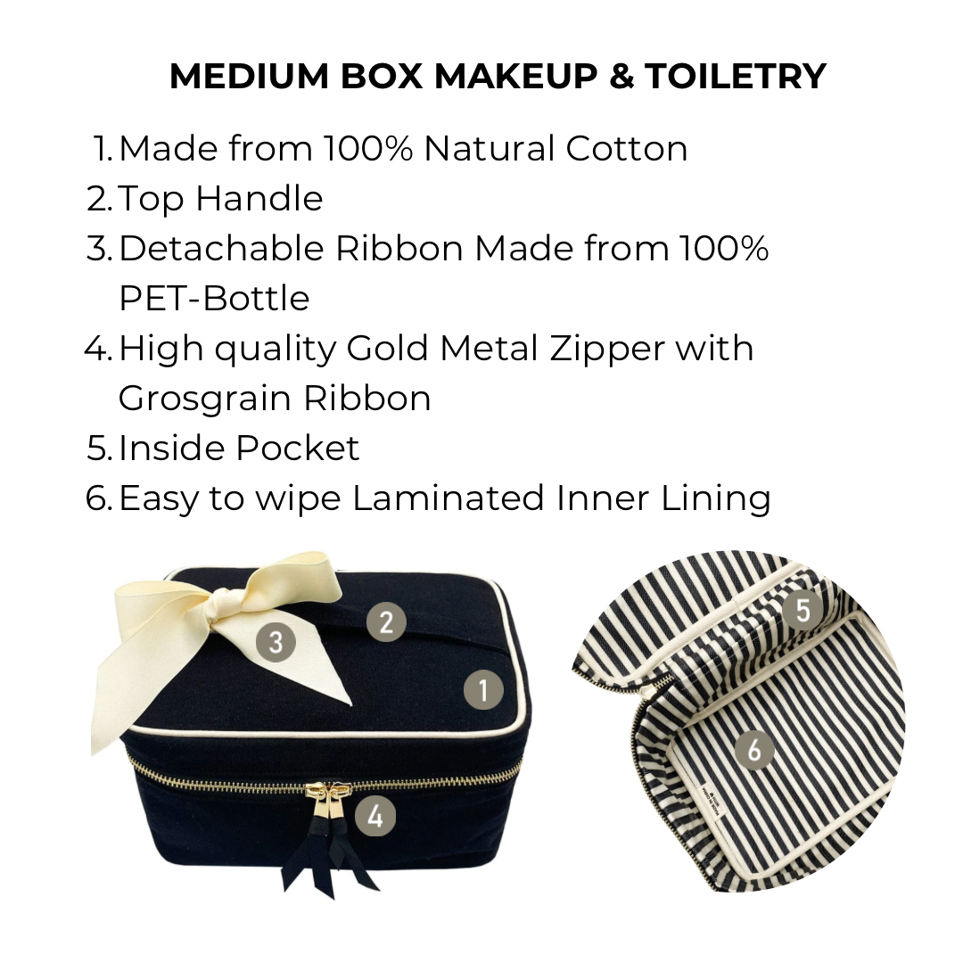 Bag-all Medium Box Makeup & Toiletry in black cotton with gold zipper, detachable recycled ribbon, and striped laminated lining for organized travel storage