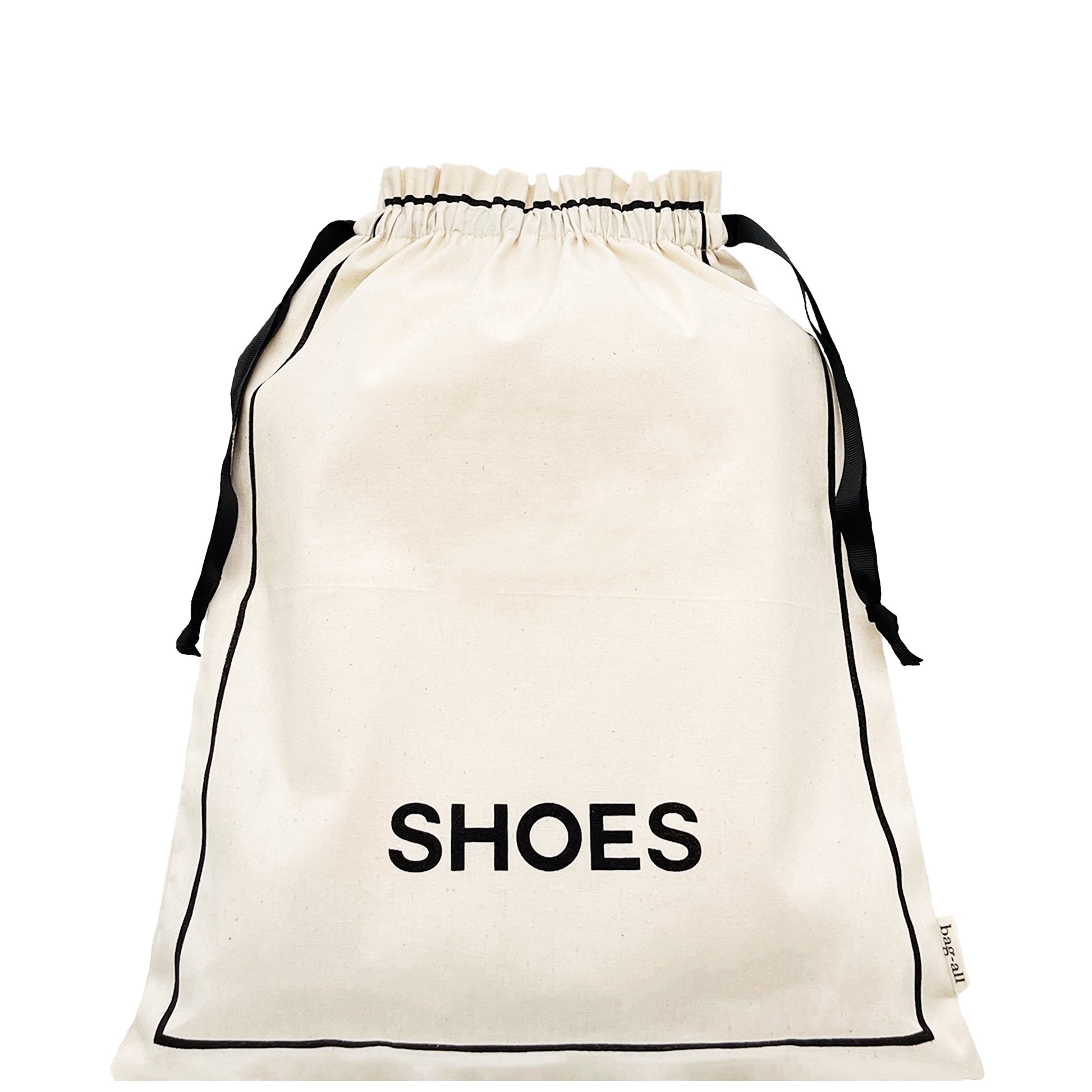 Bag-all Couture Shoe Travel Bag in cream cotton with black drawstring closure and 'SHOES' text print, perfect for organized footwear storage and travel