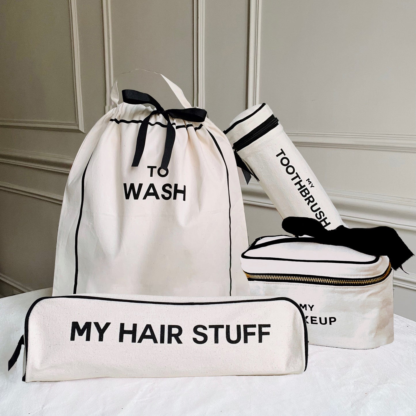 Bag-all Deal Gift Set featuring cream cotton travel organizers - To Wash laundry bag, My Hair Stuff case, toothbrush holder, and makeup box with black trim and striped lining