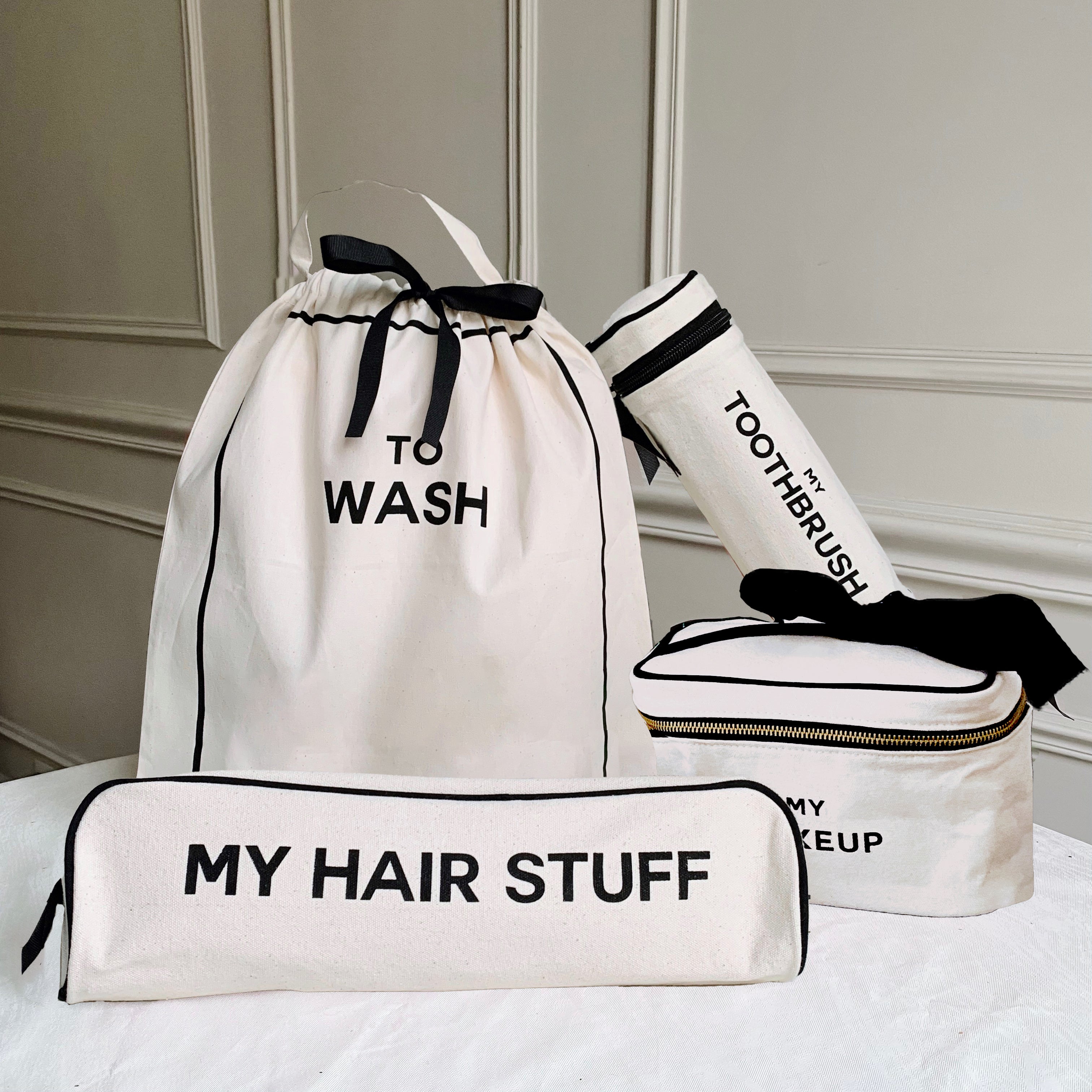 Bag-all Deal Gift Set featuring cream cotton travel organizers - To Wash laundry bag, My Hair Stuff case, toothbrush holder, and makeup box with black trim and striped lining