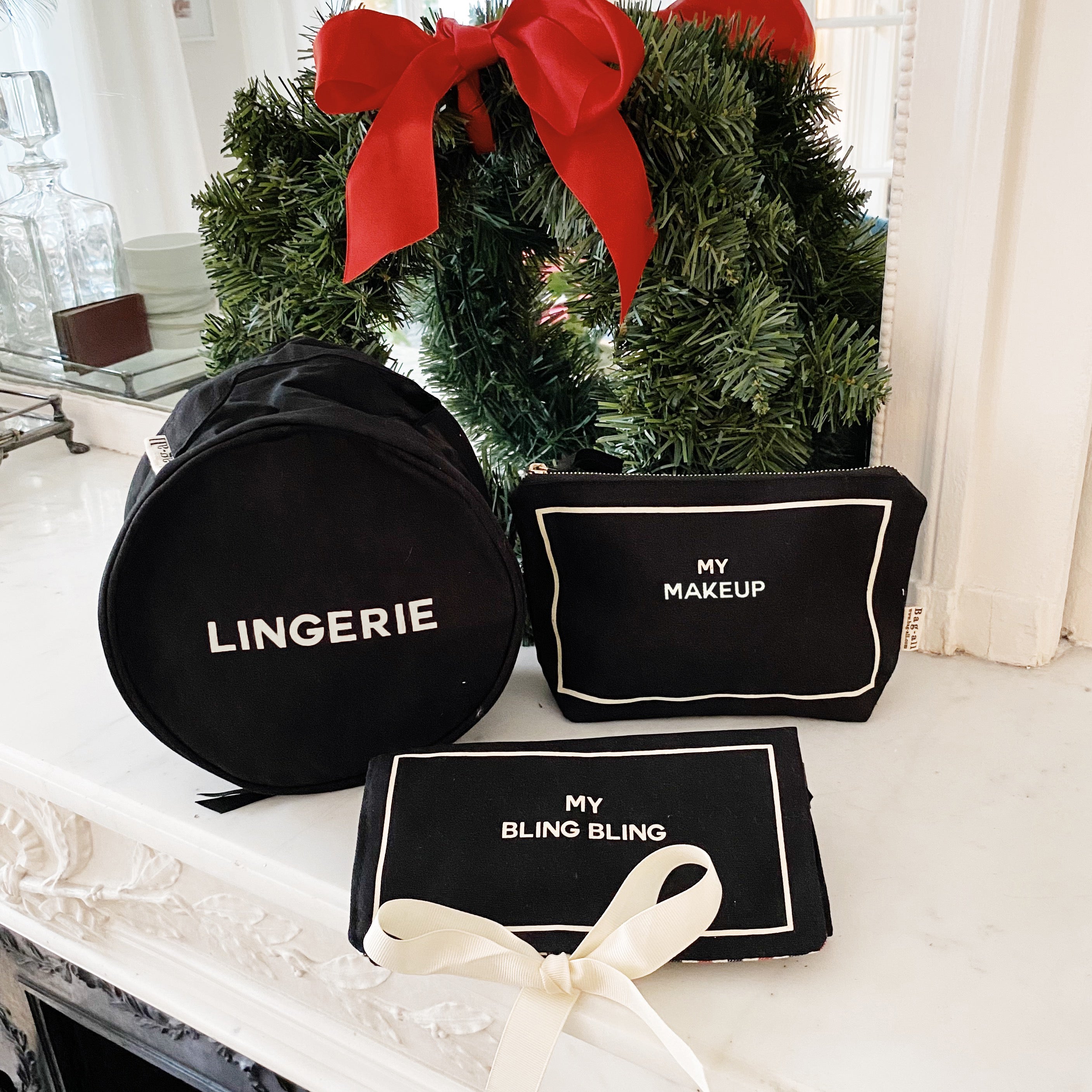 Black Bag-all gift set for her with lingerie case, makeup pouch, and jewelry case with holiday wreath background