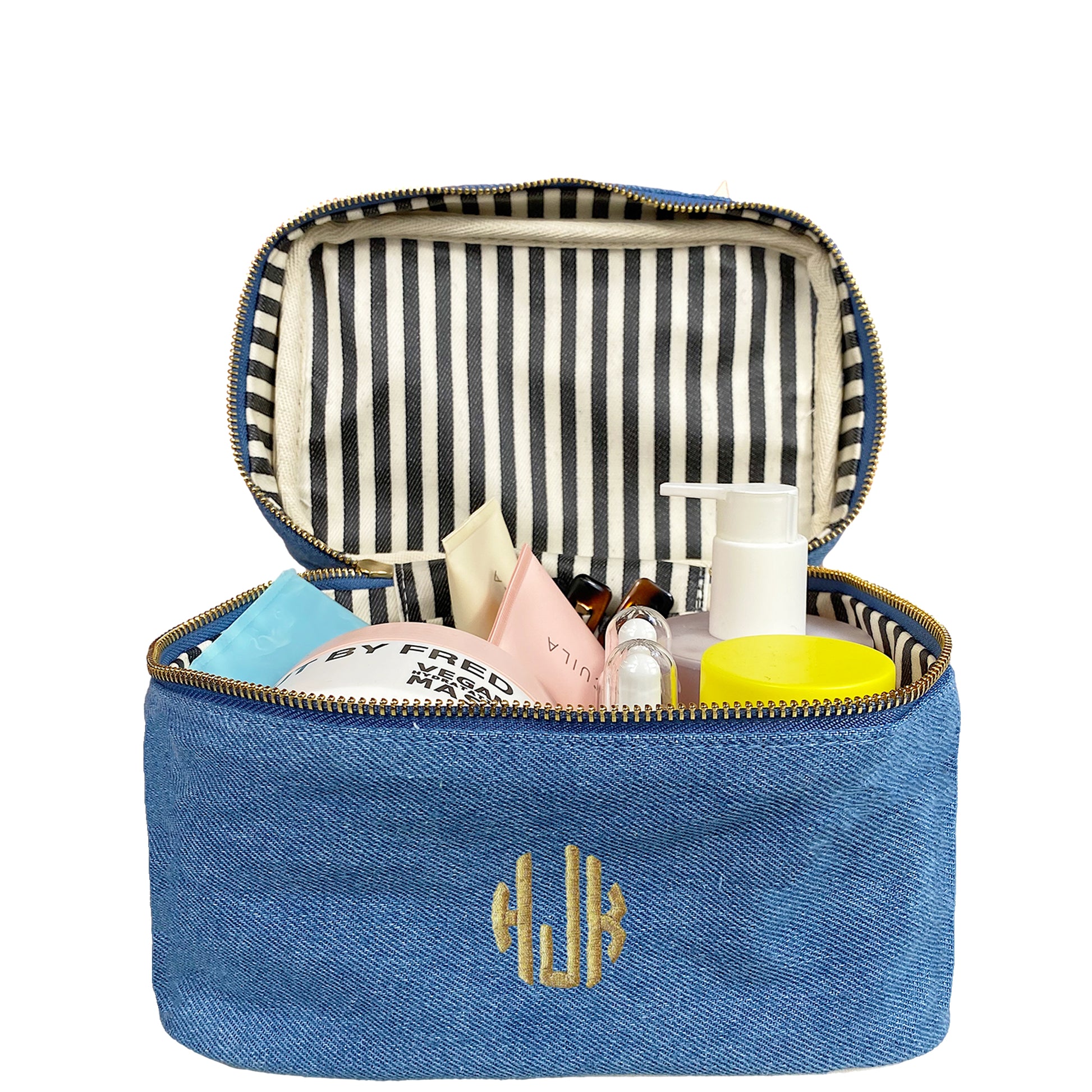 Bag-all My Makeup Cosmetic Box in Denim featuring striped interior lining, open to display beauty products and toiletries with waterproof design and monogram detail