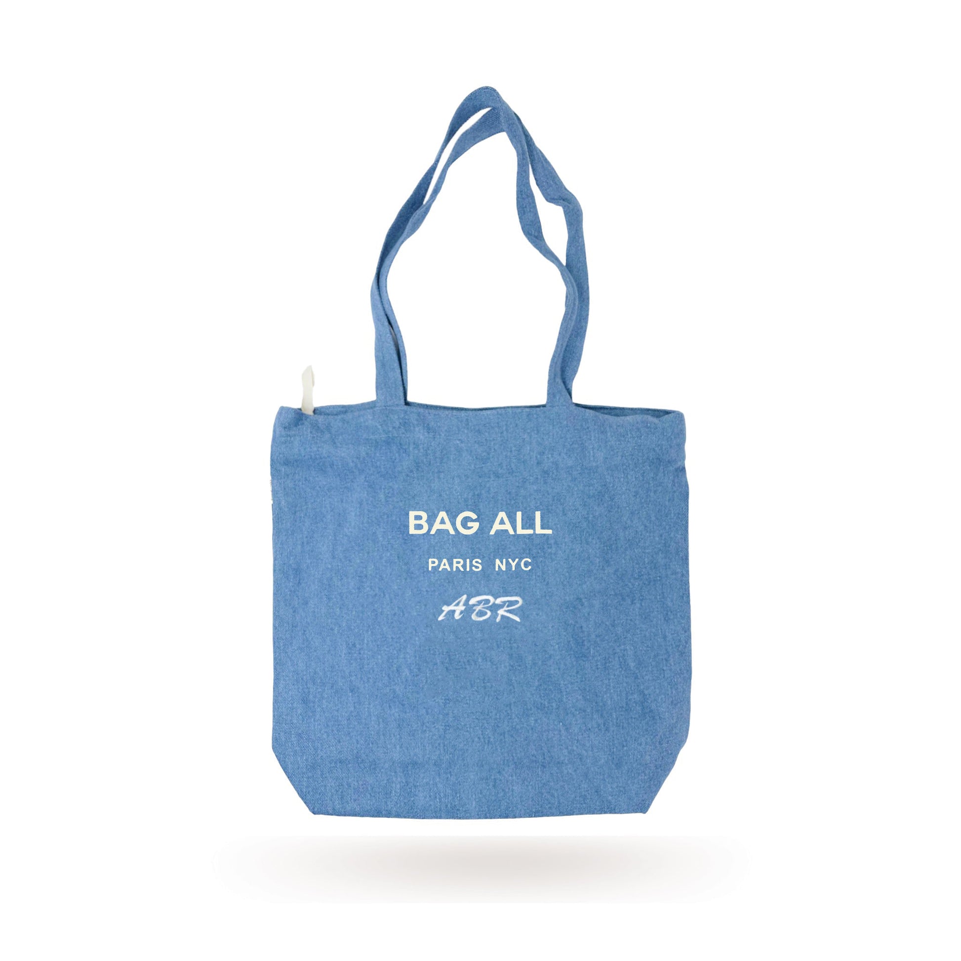 Bag-all Paris Le Marais denim tote with zipper, featuring white printed logo, inside pocket and long handles. Stylish everyday carry-all made from 100% denim with water-based eco-friendly print.