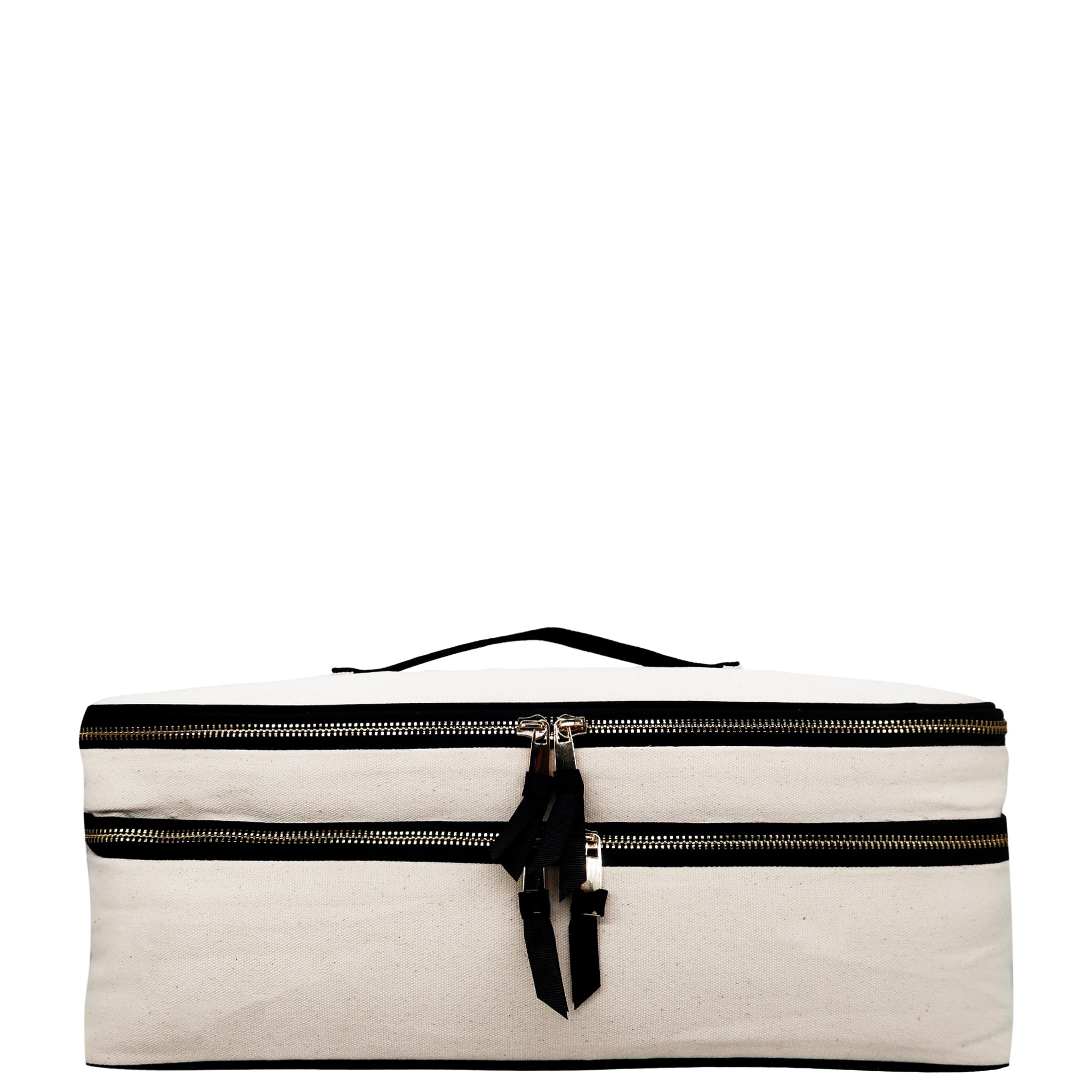 Cream double hair styling tool travel case with black zippers and handle by Bag-all on white background