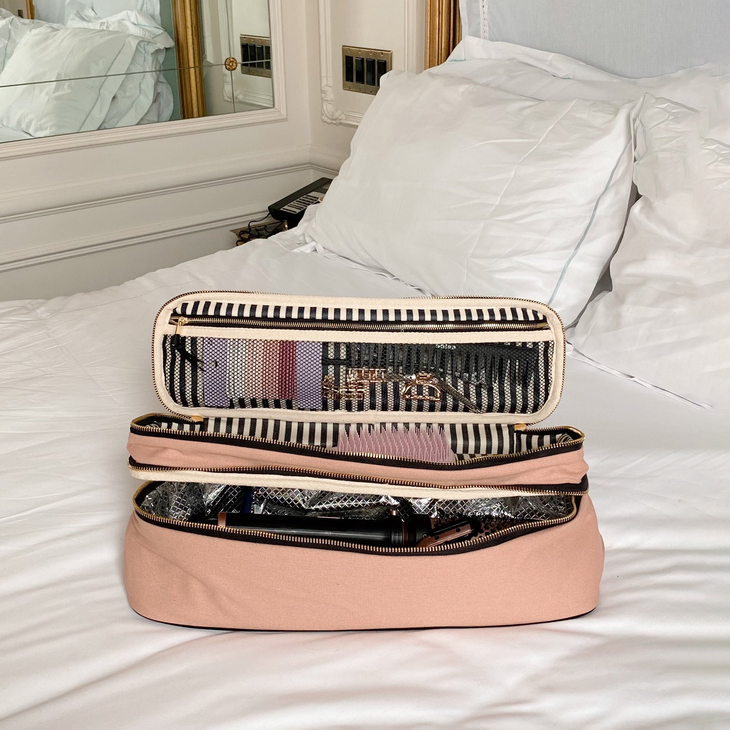 Bag-all Double Hair Tools Travel Case in Pink/Blush features dual compartments with heat-protective lining, secure bands, and storage pocket, perfect for organizing styling tools and accessories