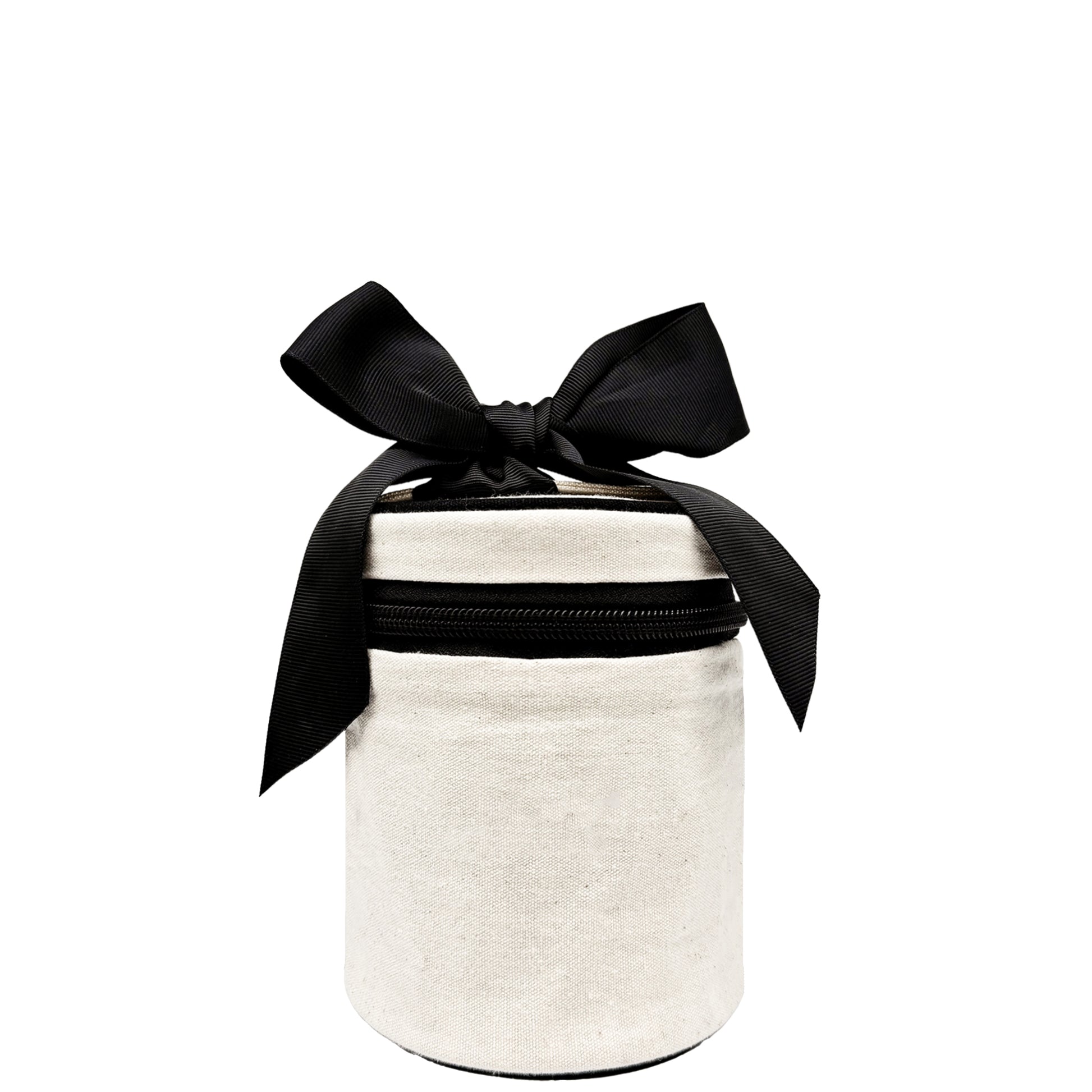 Cream carry on liquids case with black bow and zipper, compact design by Bag-all for travel essentials organization