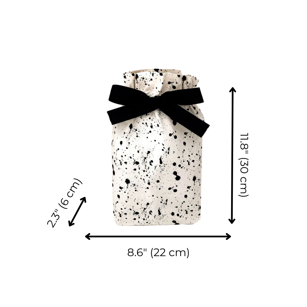 Bag-all Gift Bag Splatter Small: Eco-friendly reusable cotton gift bag with black and white splatter pattern, black bow accent, drawstring closure, sized 11.8 x 8.6 inches