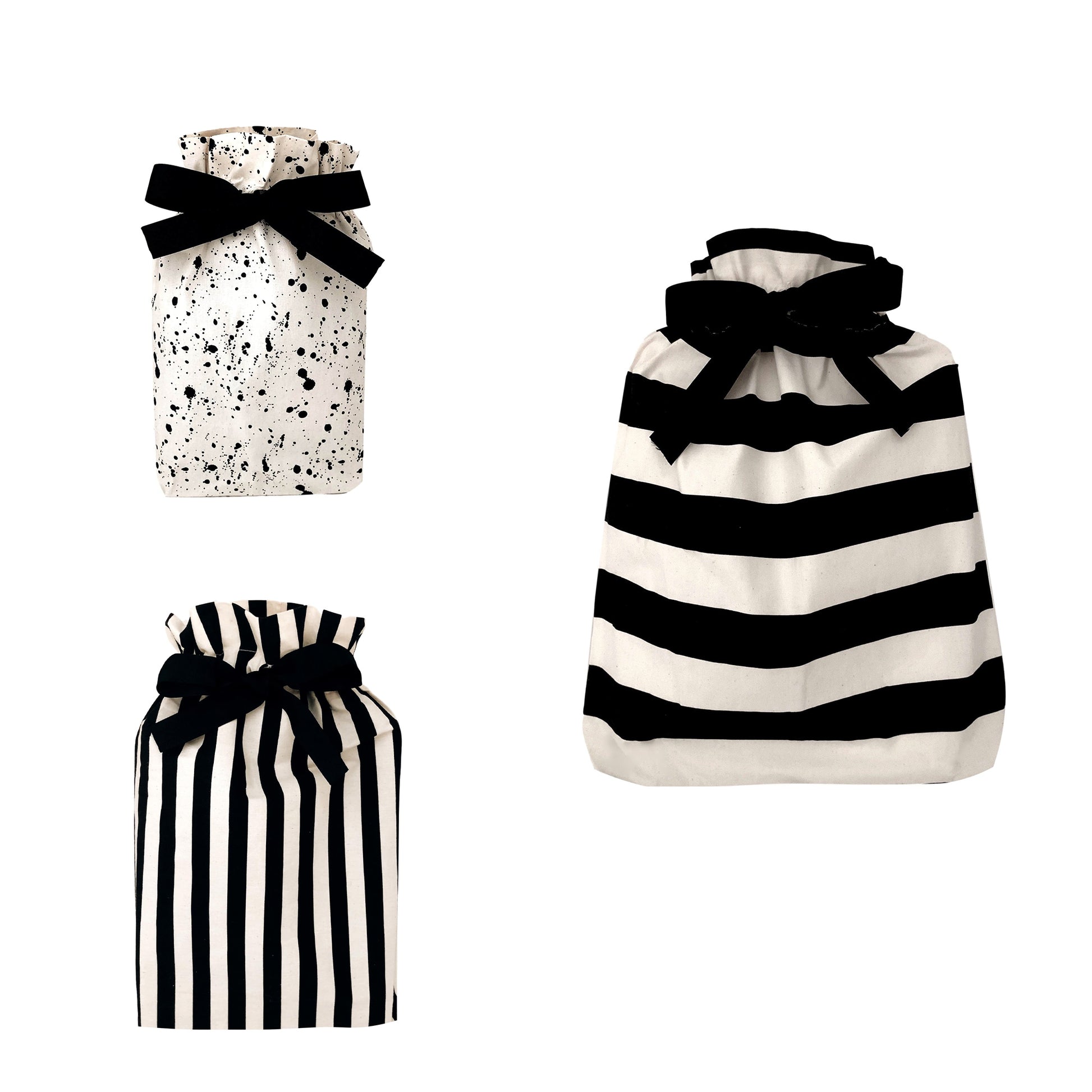 Bag-all Gift Bags Set Mix 2: stylish reusable fabric bags featuring splatter and striped patterns in black and white, adorned with elegant black bows, perfect for sustainable gift wrapping
