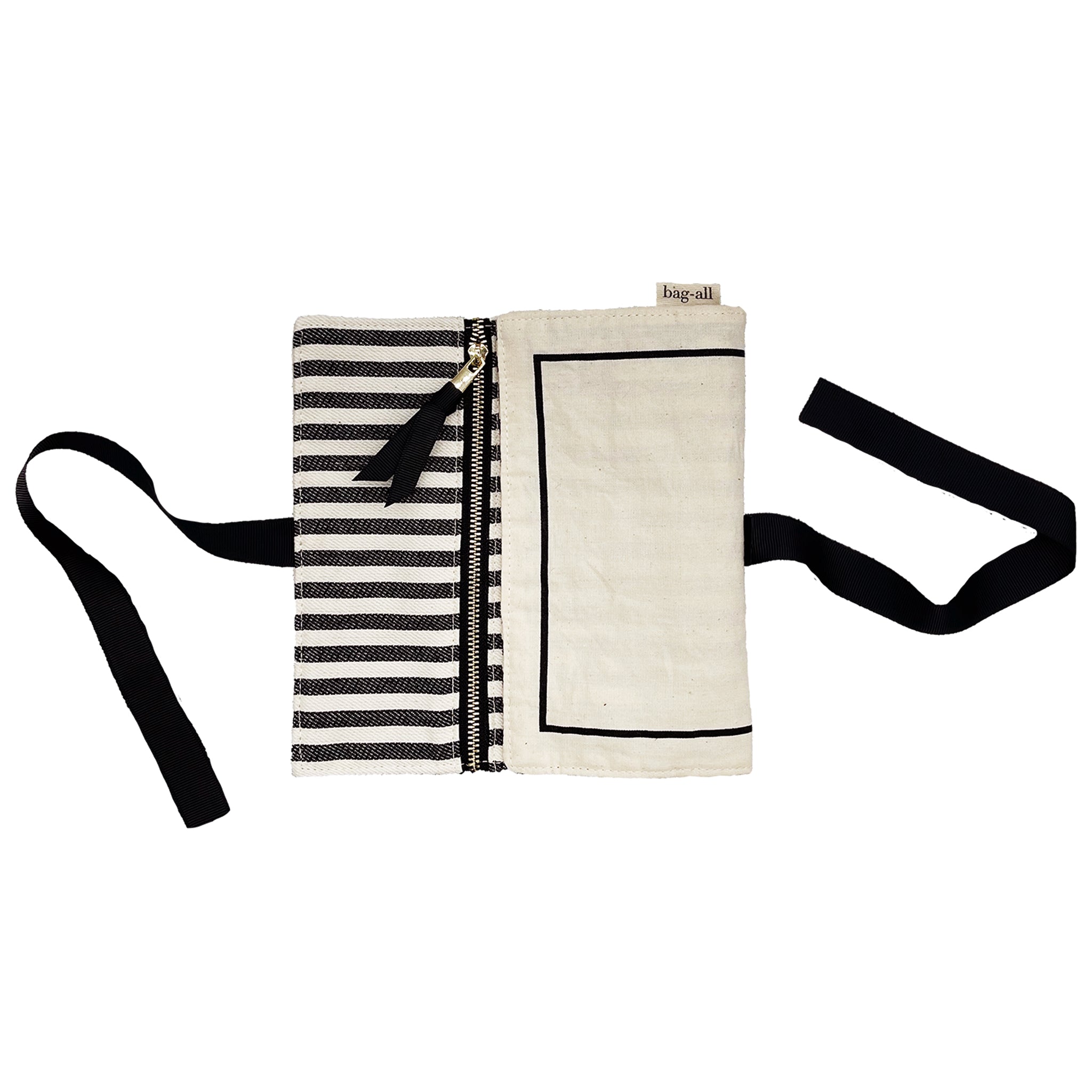 Bag-all Couture Jewelry Roll Medium in cream with black striped lining, featuring multiple zippered compartments and tie closure for elegant jewelry organization and travel storage