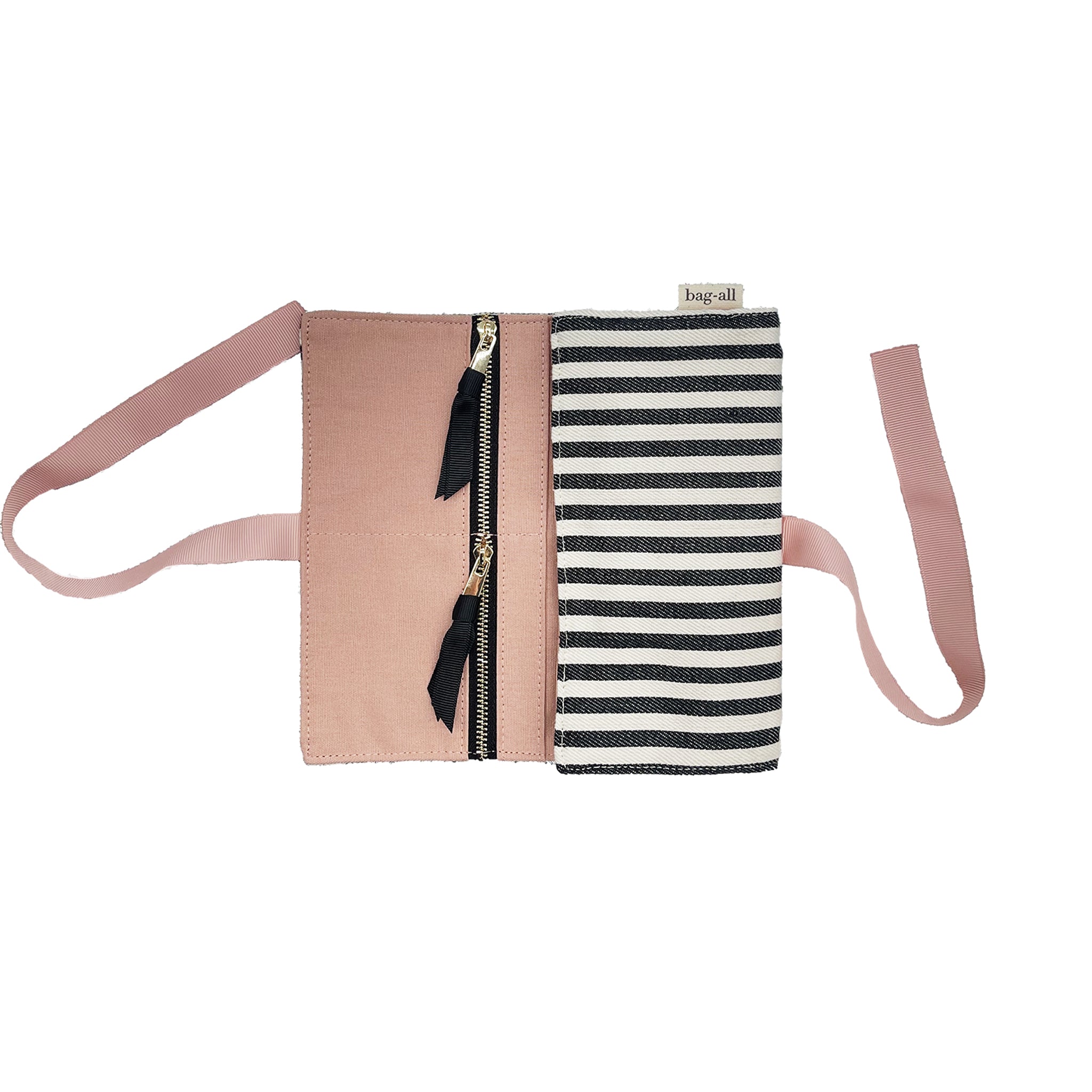 Bag-all Couture Jewelry Roll Medium featuring black and white stripes, pink leather trim, dual zipper compartments, and tie closure for elegant jewelry storage and organization