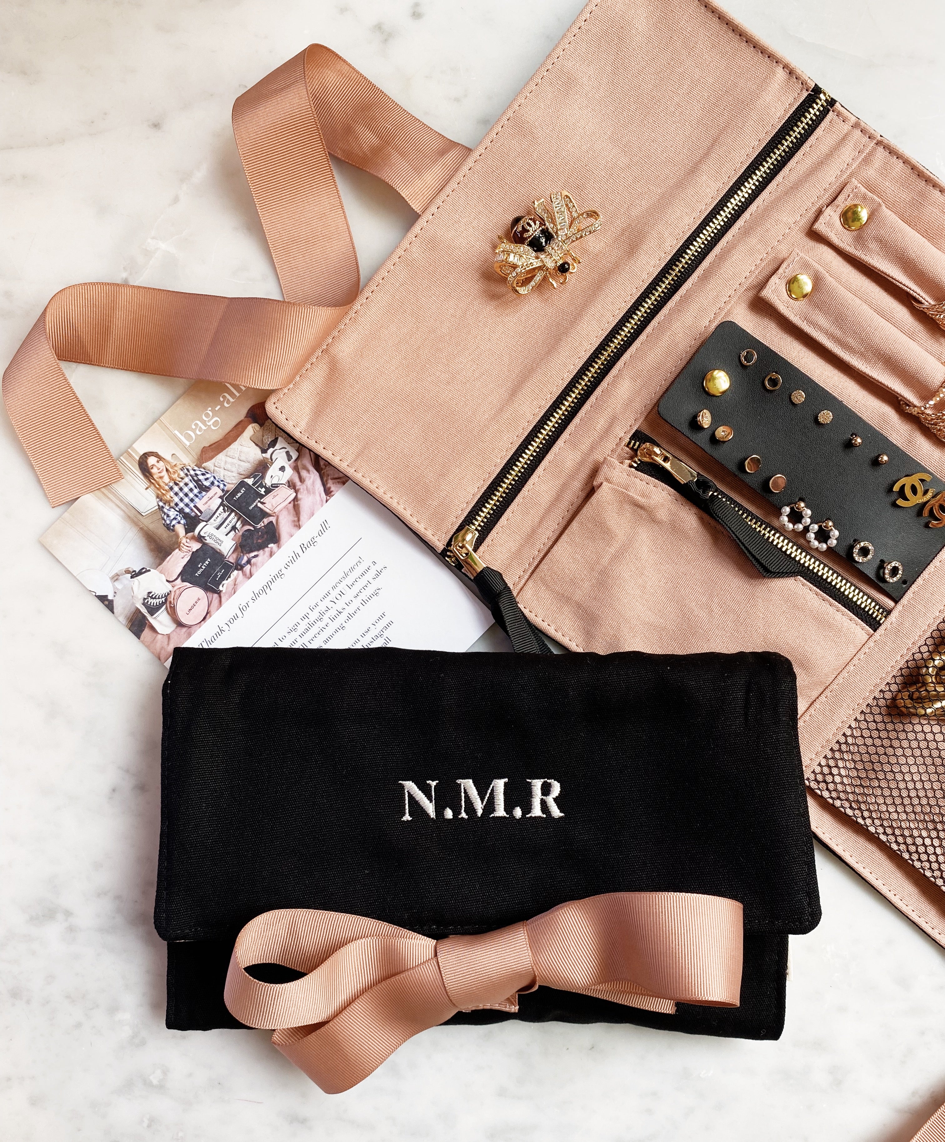 Bag-all Large Jewelry Roll in black with monogram option - elegant travel organizer with multiple compartments for necklaces, rings, and accessories, featuring pink silk ribbon closure