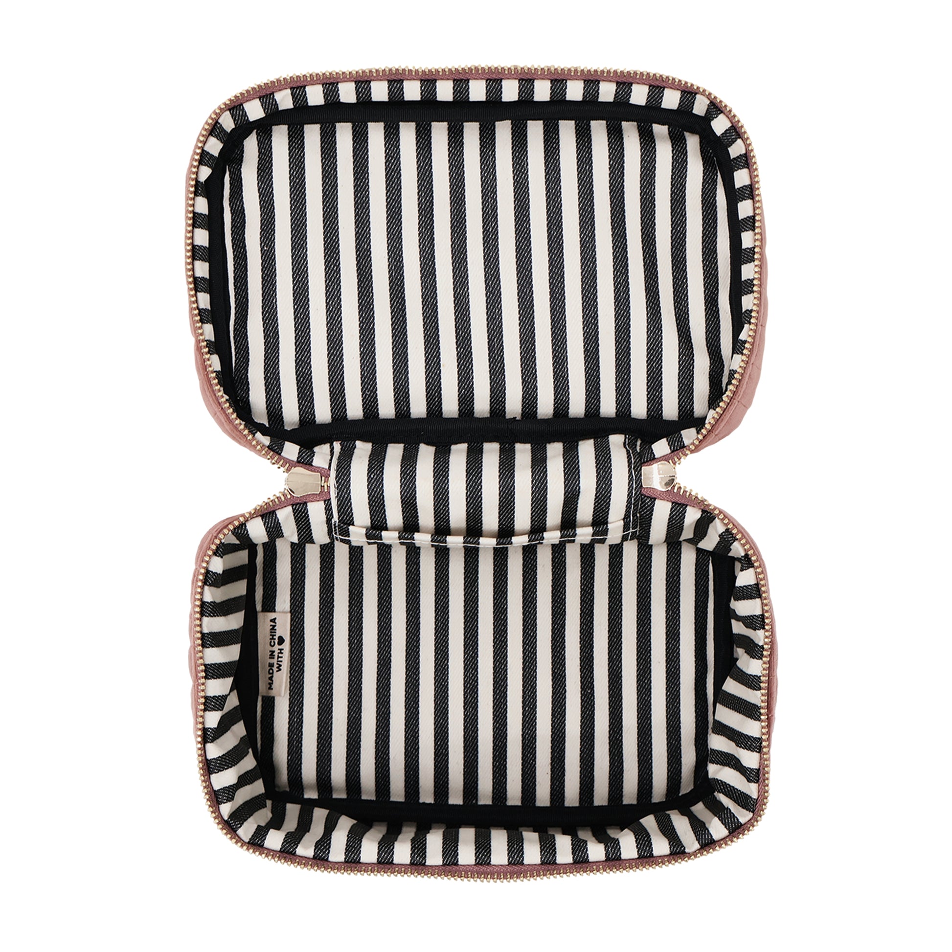 Open pink quilted eco velvet makeup case with black and white striped interior by Bag-all