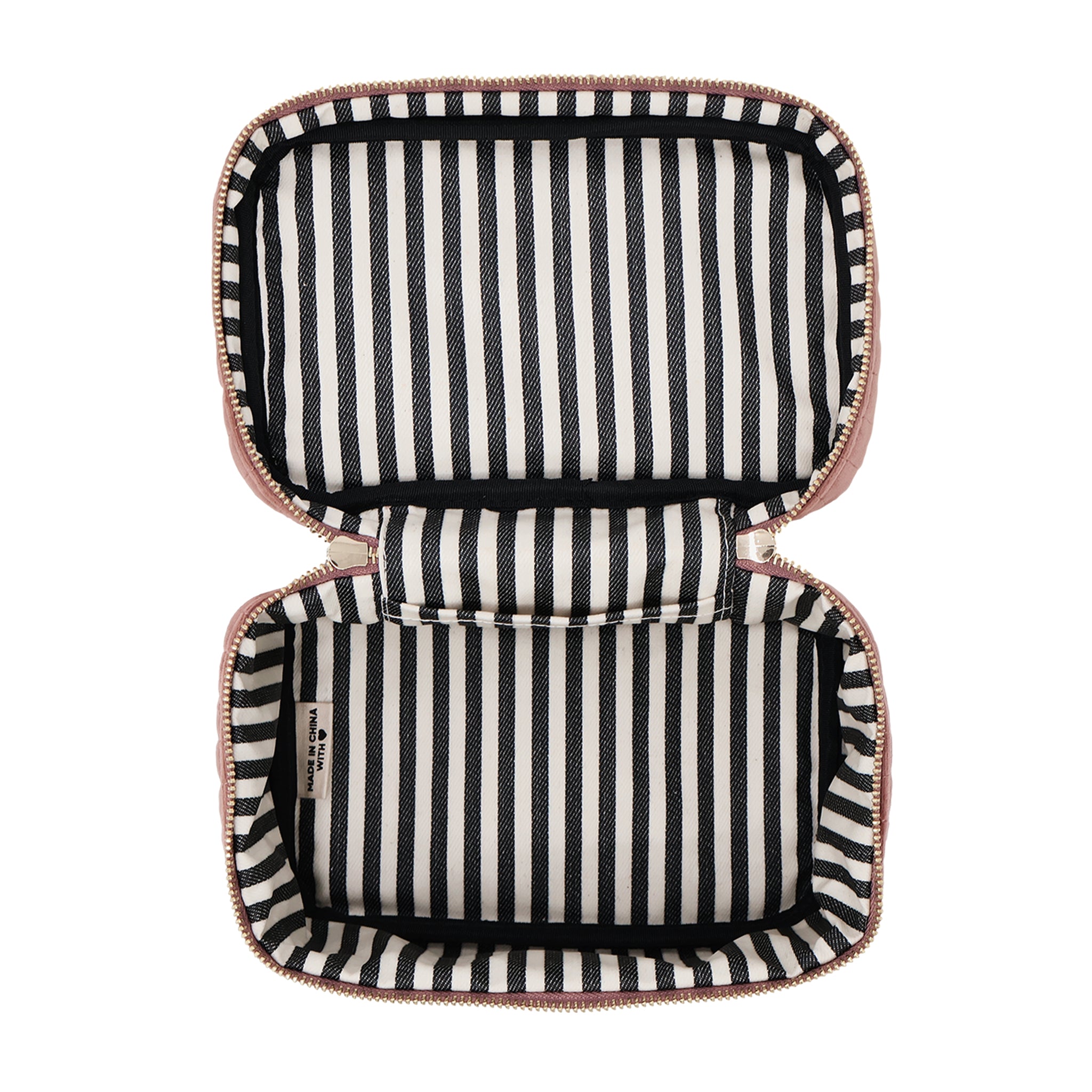 Open pink quilted eco velvet makeup case with black and white striped interior by Bag-all