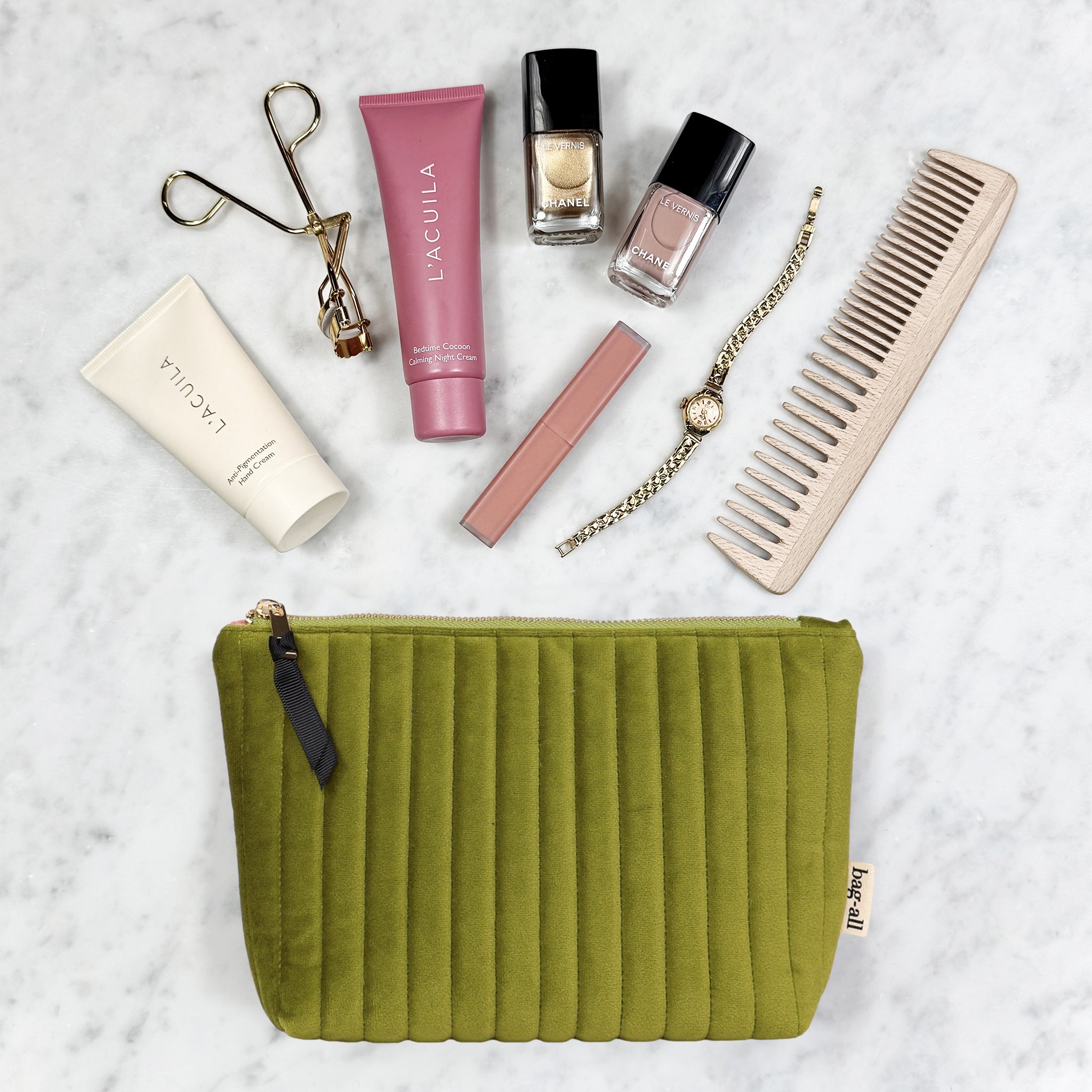 Bag-all eco-velvet green makeup and jewelry pouch with cosmetics, nail polish, watch, comb, and eyelash curler in gallery one view