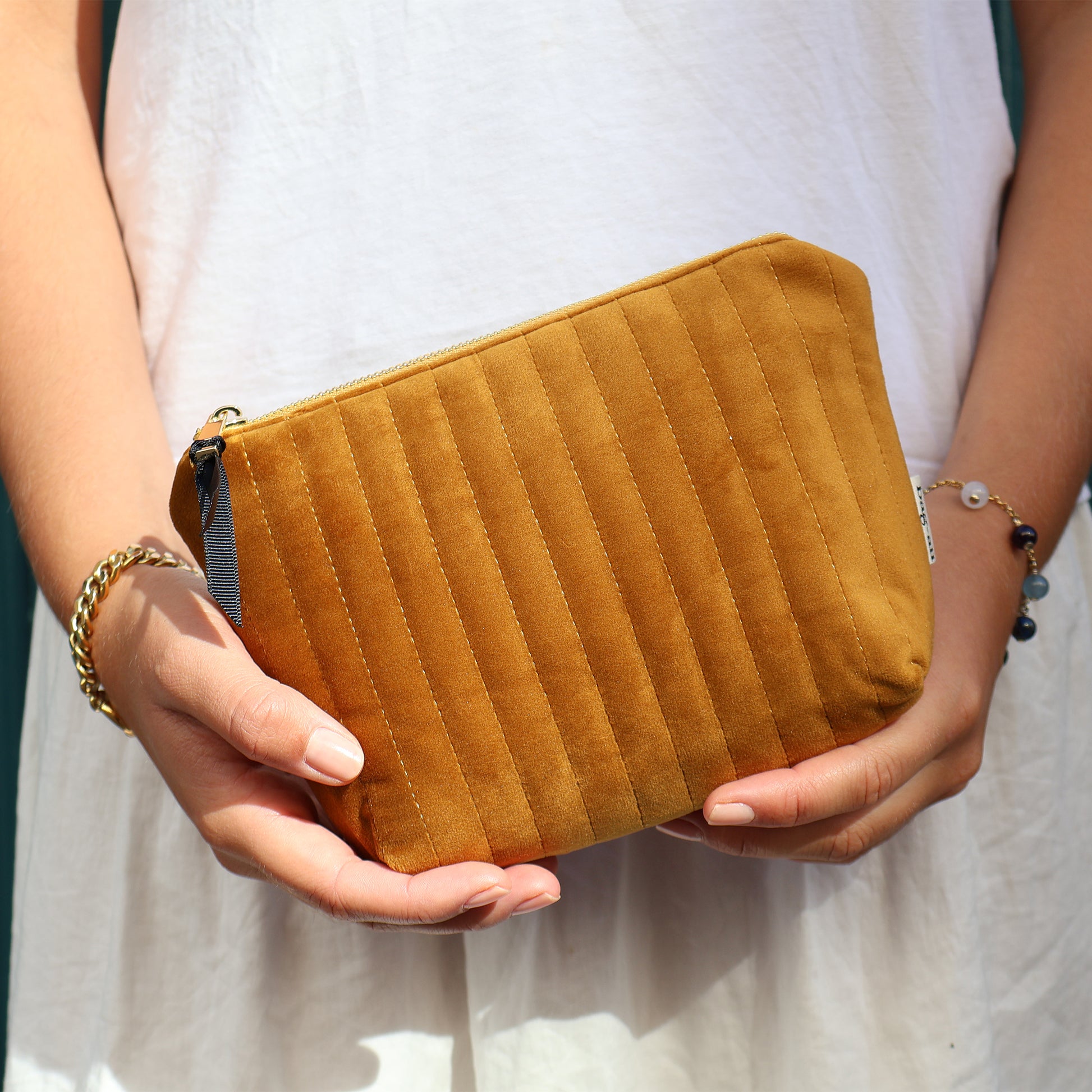 Handheld yellow quilted eco velvet makeup bag by Bag-all, ideal for organized and stylish everyday use.