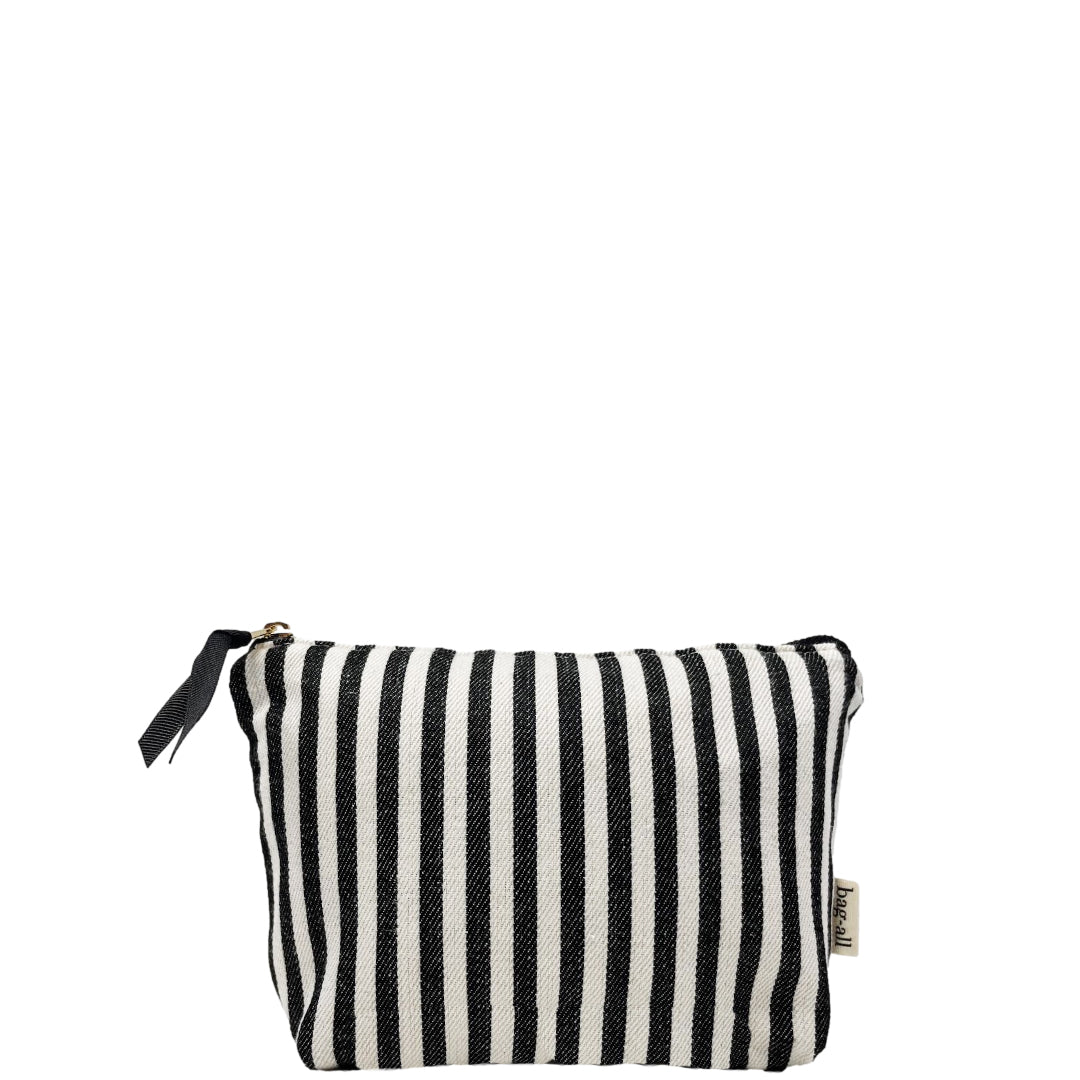 Bag-all Striped Makeup Pouch with pink waterproof lining, black and white vertical stripes, gold zipper, compact cotton design for daily beauty essentials