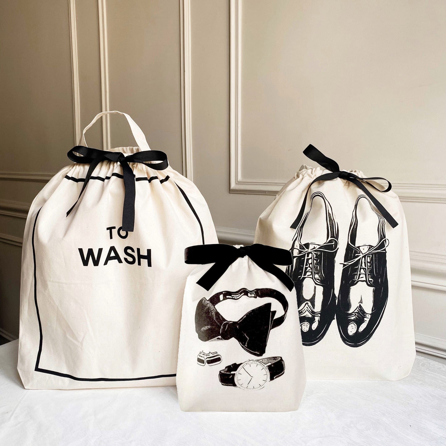 Bag-all Deal Gift Set His Favorites 3-pack with "To Wash" laundry bag, men's shoe bag, and accessories bag featuring black bow closures and elegant monochrome prints on natural cotton