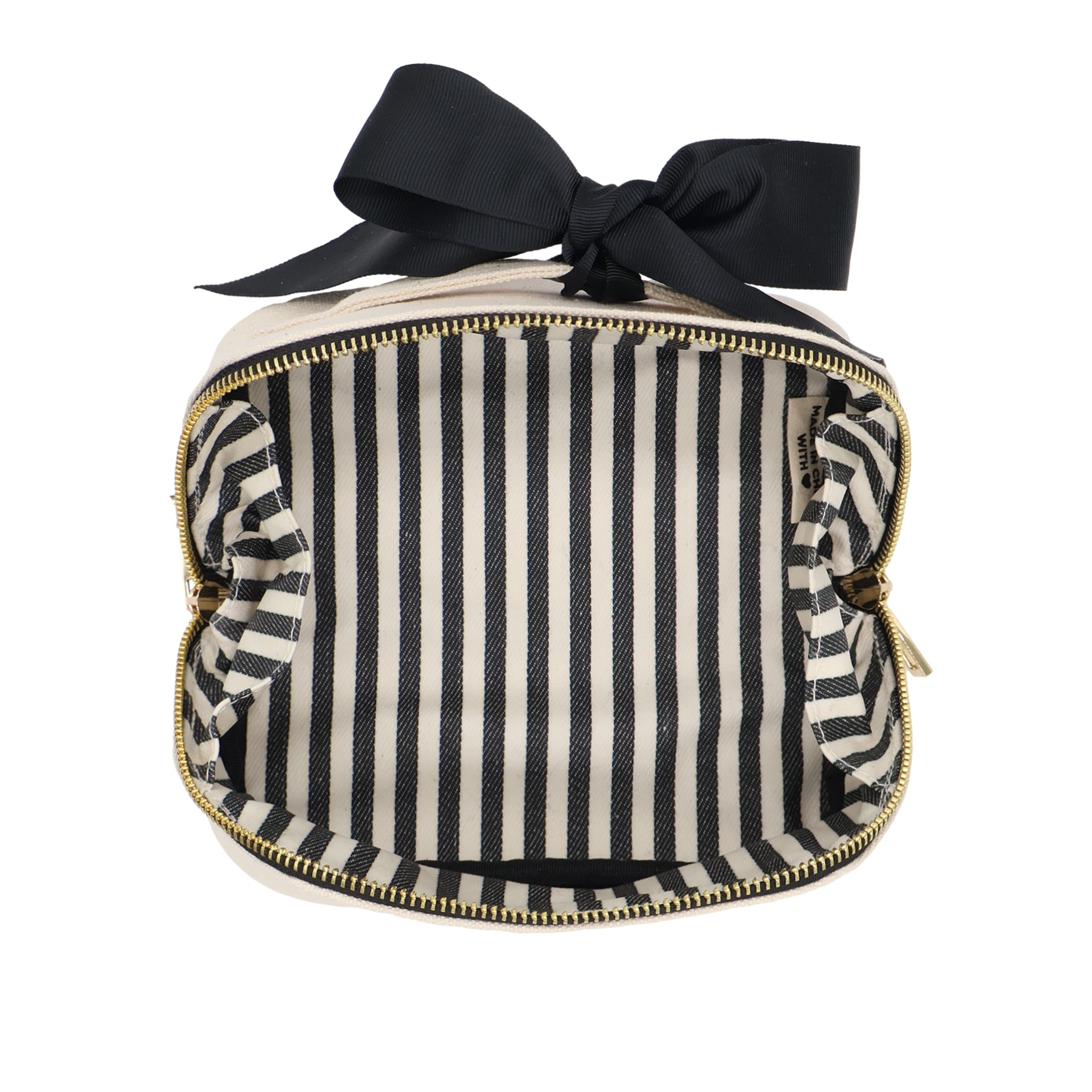 Petite Accordion Makeup Case – Cream with striped laminated interior, gold zipper, and black bow by Bag-all for personalized travel organization.