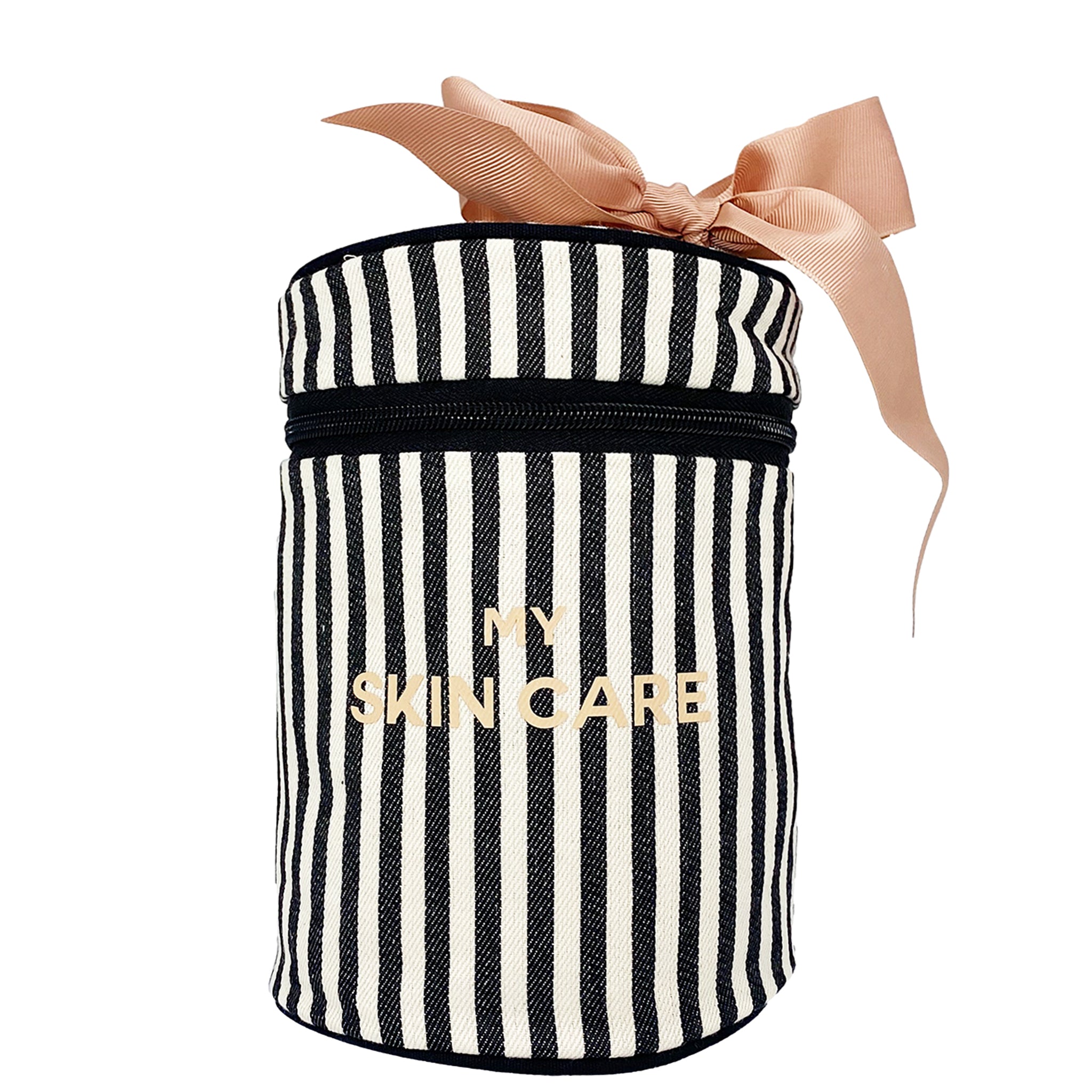 Bag-all Round Skin Care Case with Handle featuring black and white stripes, pink bow accent, and gold text. Cylindrical travel organizer with secure zipper closure.