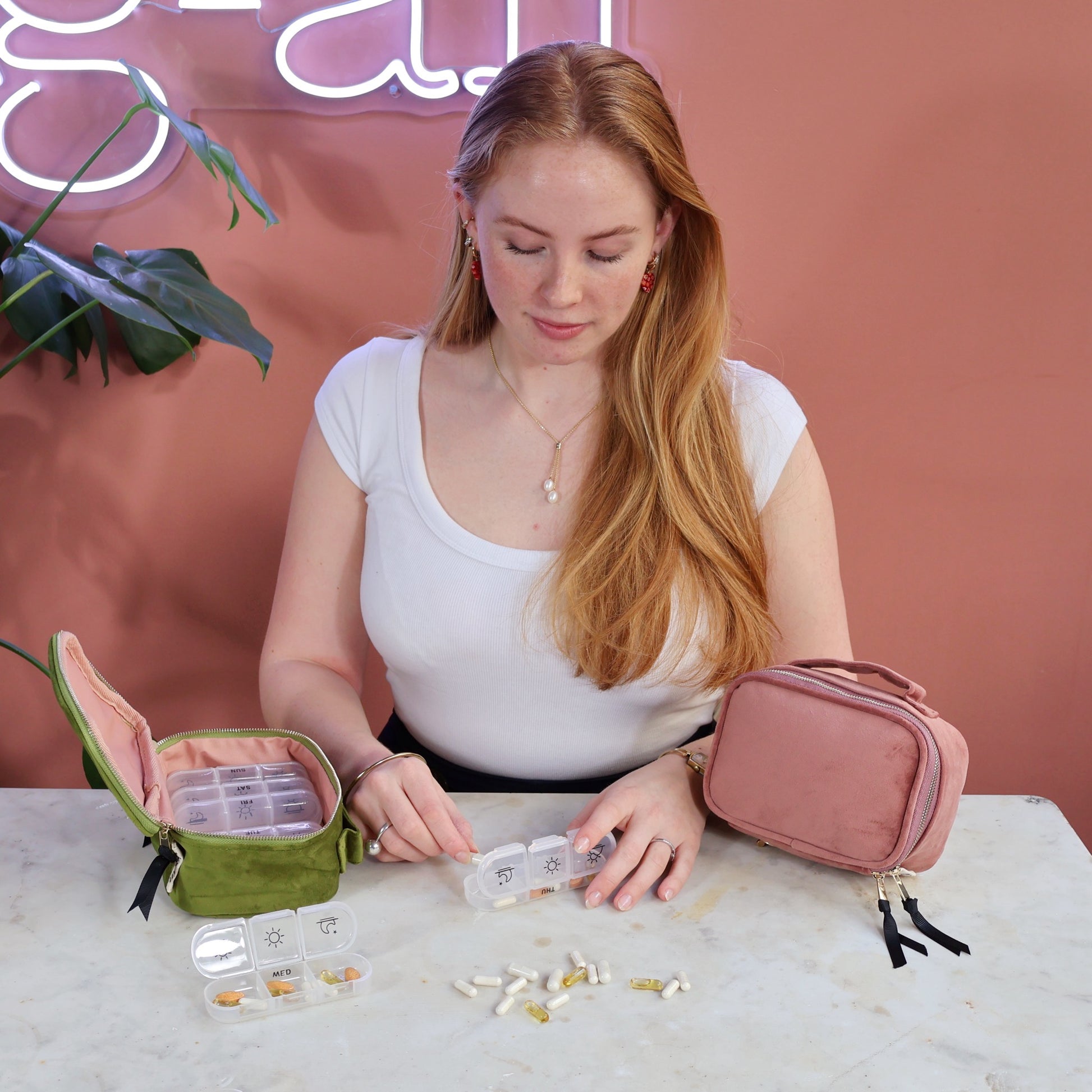 Bag-all Large Pill Box in Pink Eco Velvet with Daily Inserts, featuring compartments for organized medication storage