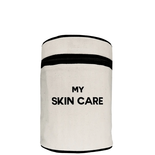 Bag-all Round My Skin Care Case in cream - cylindrical organizer with black trim and text, featuring waterproof lining and internal compartments for skincare storage
