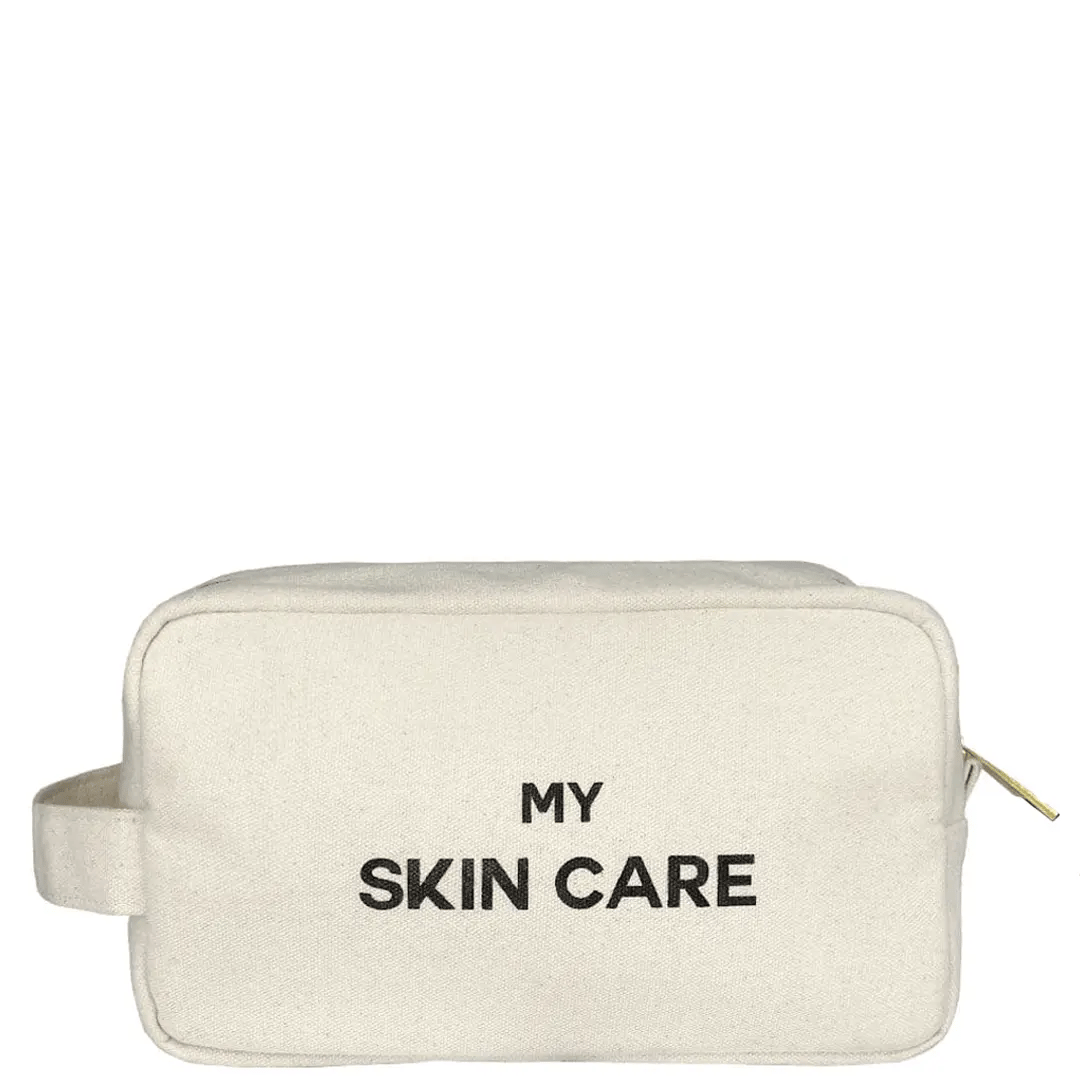 Bag-all My Skin Care Organizing Pouch in cream cotton canvas with waterproof lining, featuring black text and side handle for skincare storage and travel