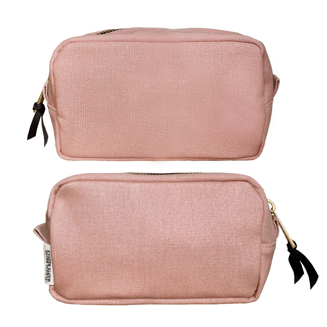 Bag-all Small Toiletry Pouch in pink blush, featuring durable canvas material, laminated interior, and black zipper details - perfect for organizing travel essentials and makeup storage