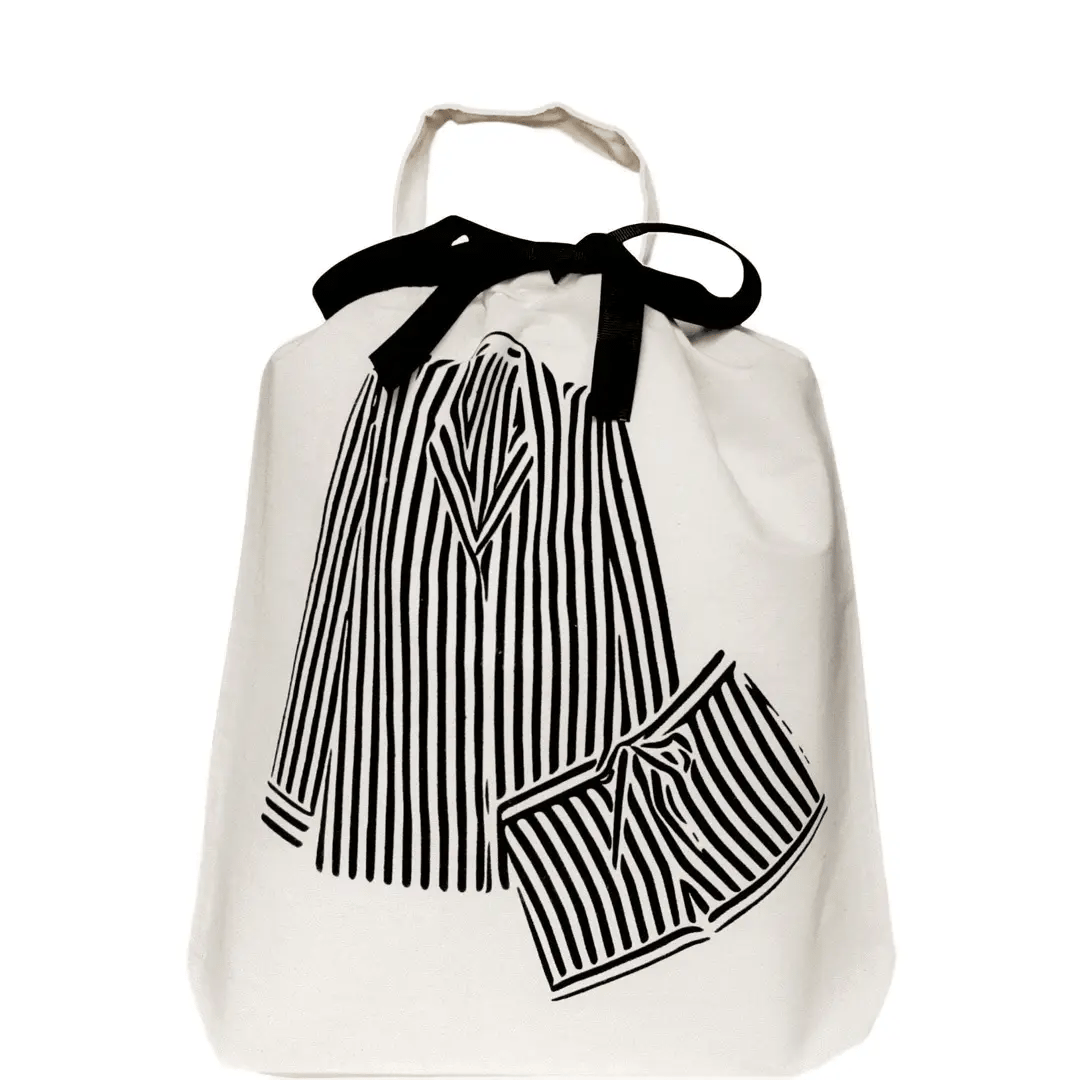 Bag-all Striped Pajamas Travel Bag in cream with black ribbon tie, featuring illustrated black and white striped pajama set design - perfect for organized travel and closet storage