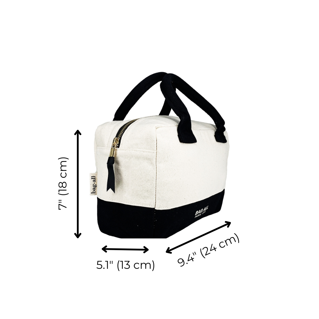 Bag-all Stylish Monogram Lunch Box in cream and black with insulated design, padded handles, and gold zipper detail. Dimensions: 9.4" x 7" x 5.1