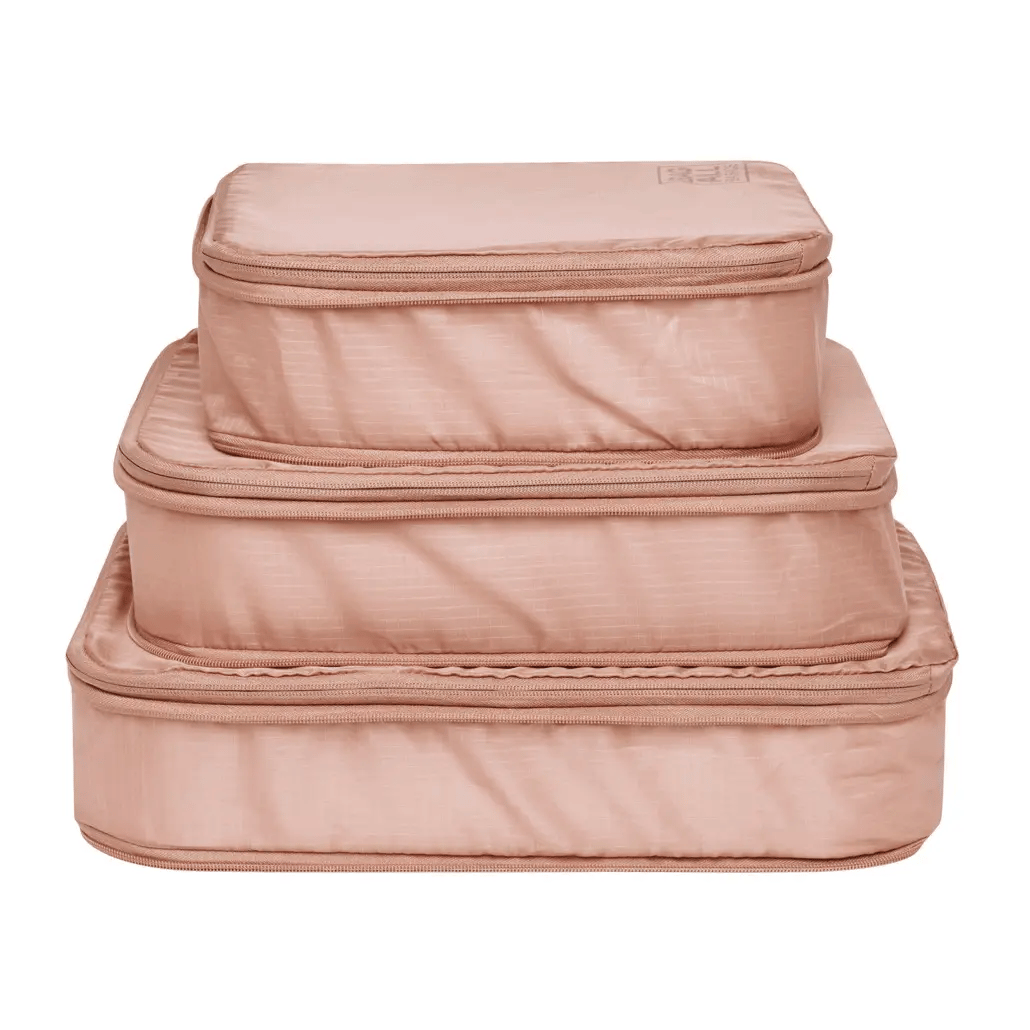 Bag-all Pink Compression Cubes & Packing Bags Set featuring 8 eco-friendly recycled nylon organizers in graduated sizes for efficient travel storage and packing