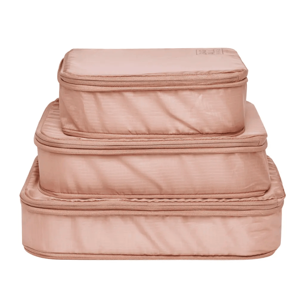 Bag-all Pink Compression Cubes & Packing Bags Set featuring 8 eco-friendly recycled nylon organizers in graduated sizes for efficient travel storage and packing