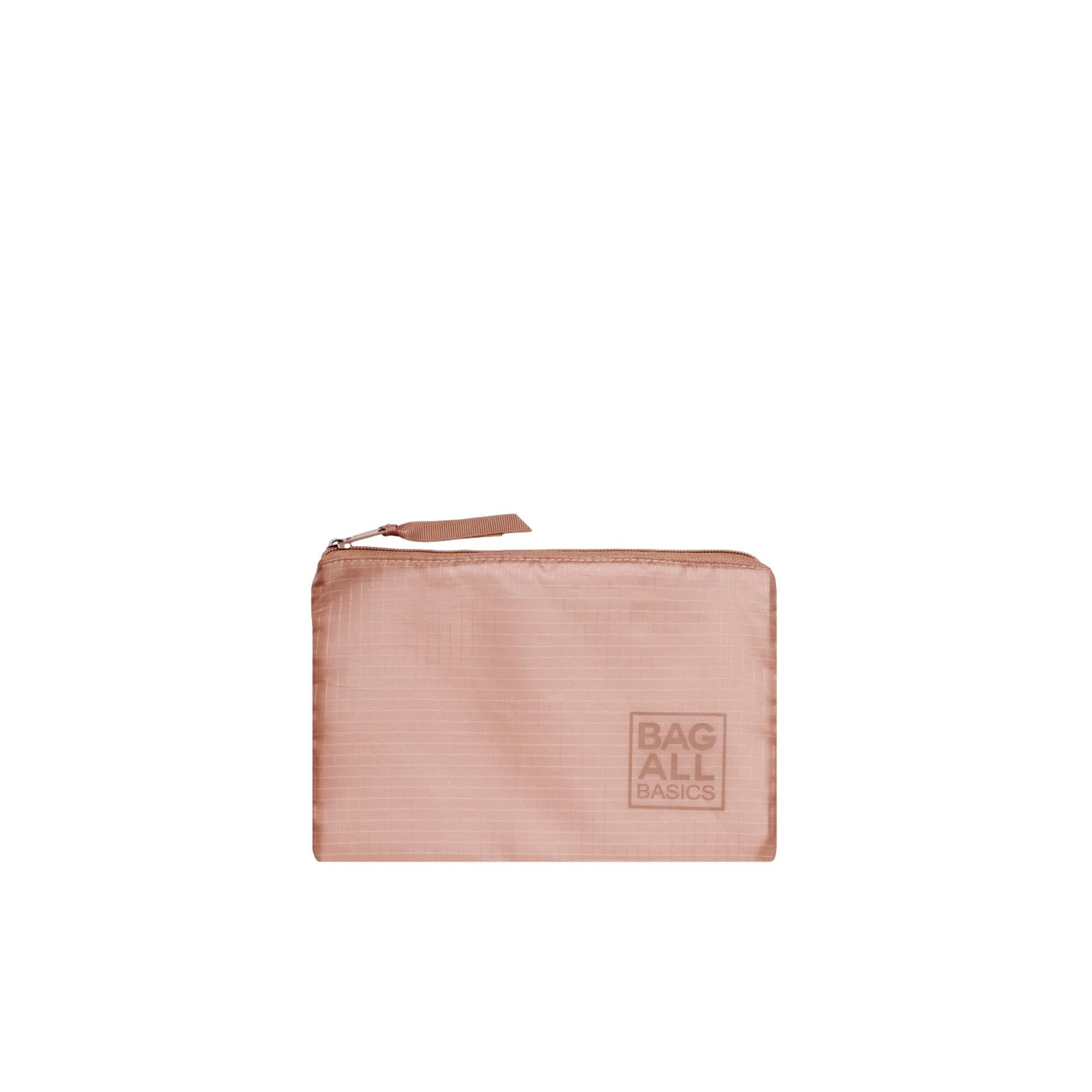 Bag-all recycled nylon pink packing bag with zip closure, part of 5-pack organizer set, featuring embossed logo in blush color and sustainable design