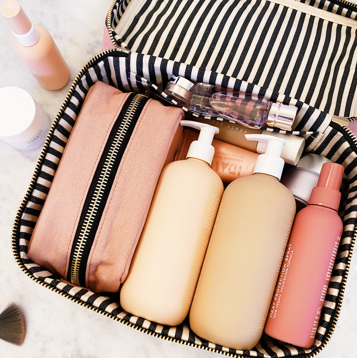 Bag-all My Vanity Large Beauty Box in Black with striped waterproof lining, showcasing organized toiletries and beauty products in compartments, perfect for travel and home storage
