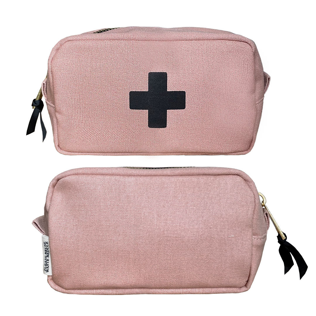 Bag-all First Aid Organizing Pouch in blush pink cotton, featuring black medical cross symbol, zipper closure and laminated interior for secure storage of medical essentials and medications