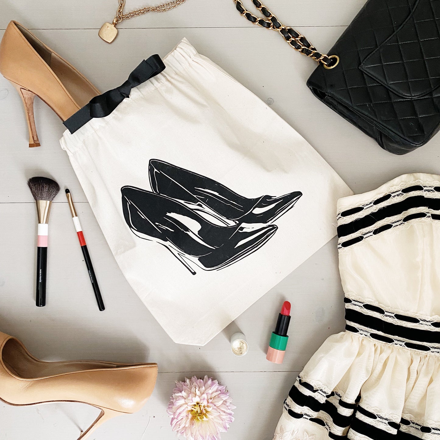 Bag-all High Heel Pumps Shoe Bag in cream cotton canvas with black stiletto print, drawstring closure and eco-friendly materials for stylish shoe storage and protection