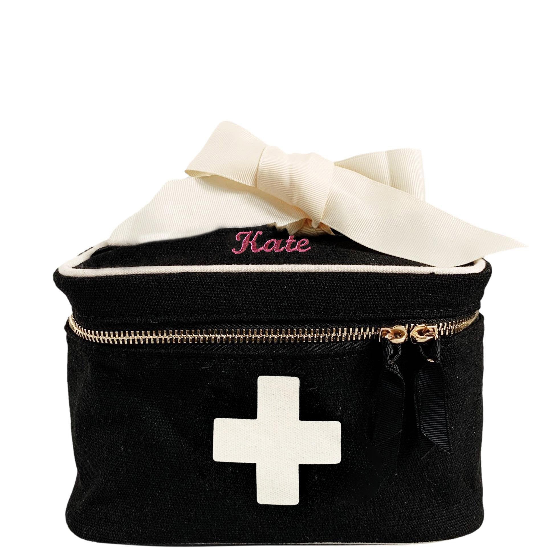 Bag-all Meds and First Aid Storage Box in black canvas with white medical cross, cream ribbon, dual zippers and personalized name Kate, perfect for organizing medications