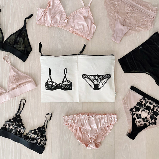 Bag-all Double Lingerie Packing Pouch in Cream with illustrated lingerie design, shown with assorted black and pink lingerie pieces, featuring dual compartments for organized intimate wear storage