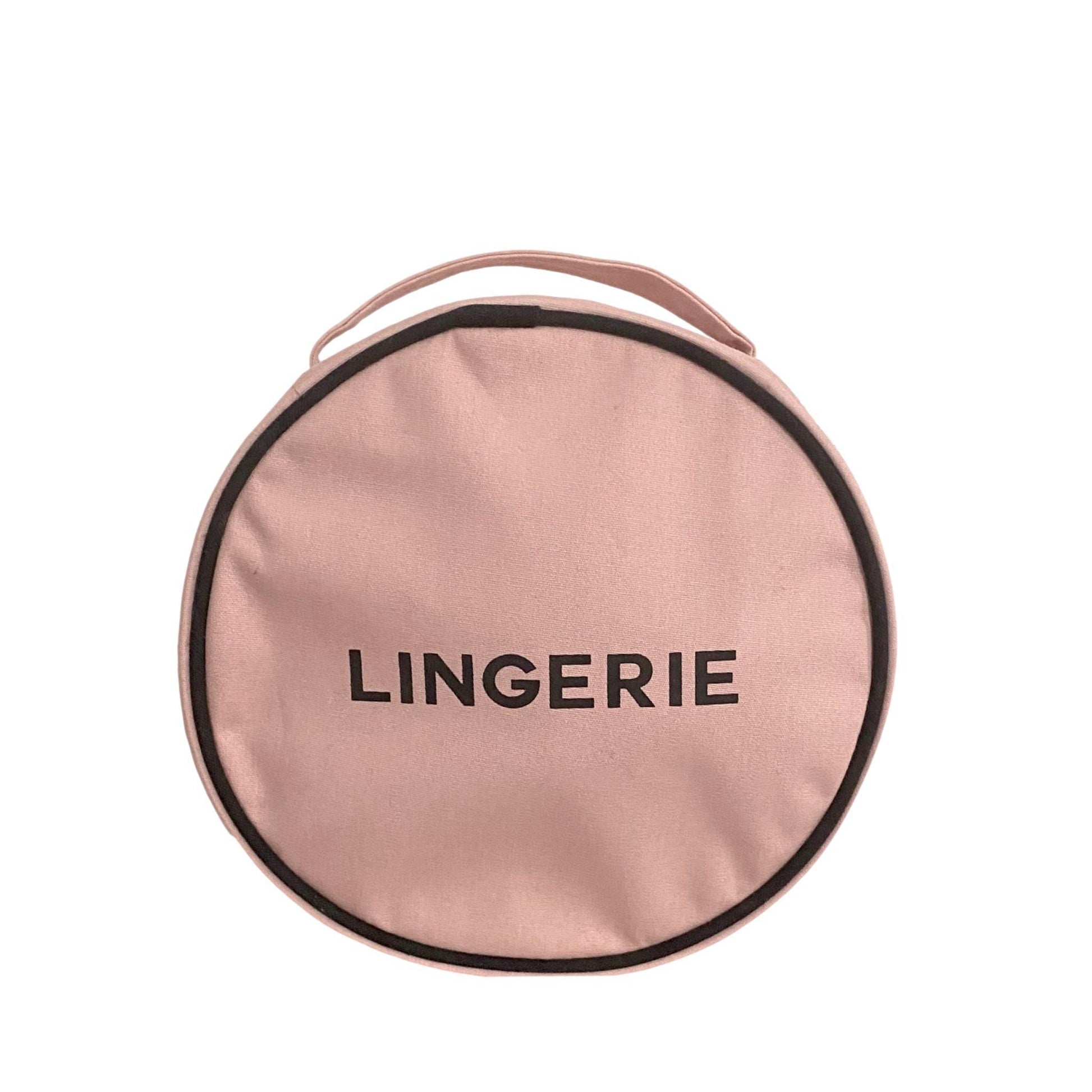 Bag-all Round Lingerie Case in blush pink cotton with black text and trim, featuring metal zipper closure for stylish travel organization and storage