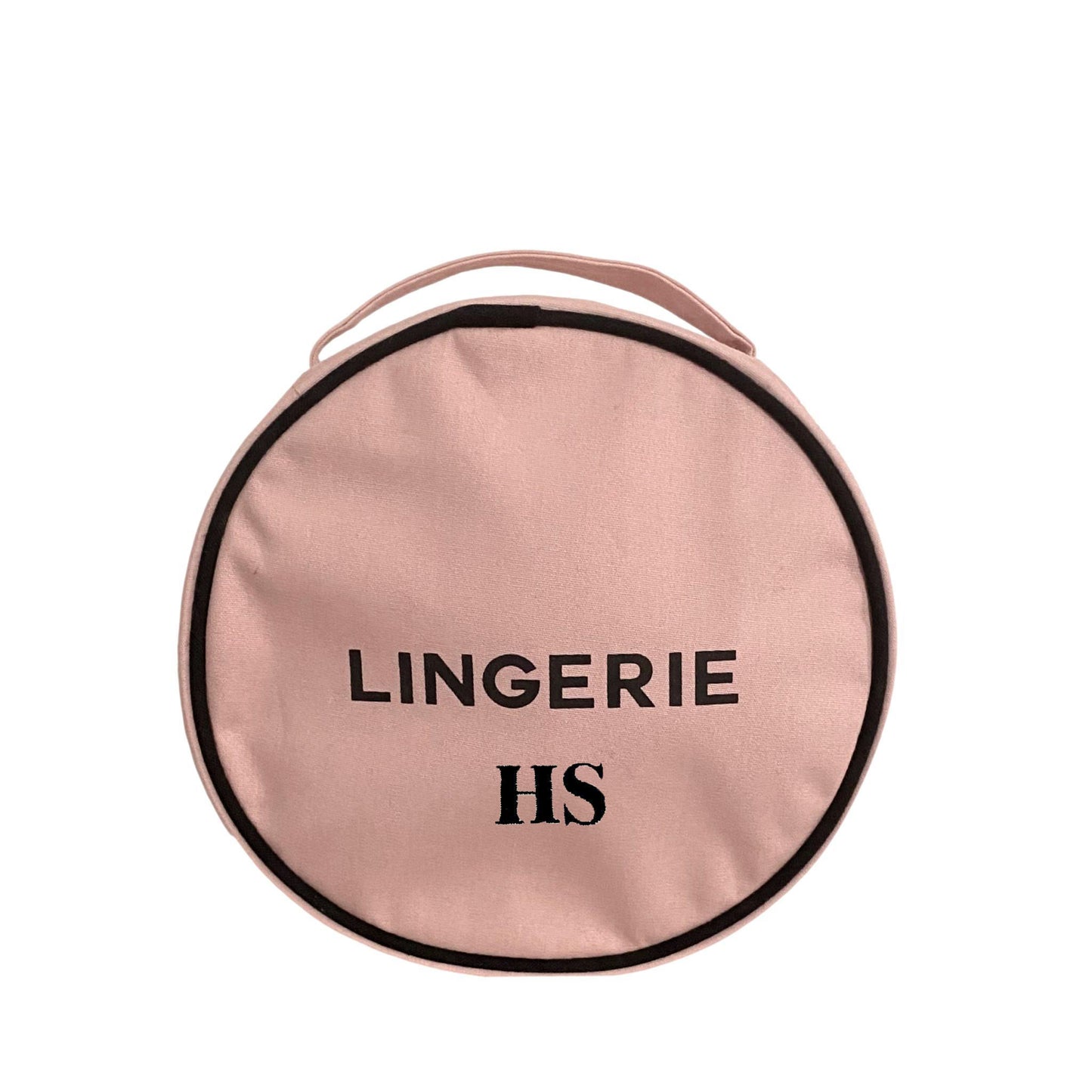 Bag-all Round Lingerie Case in blush pink cotton with black trim and text, featuring metal zipper and custom black and white interior lining