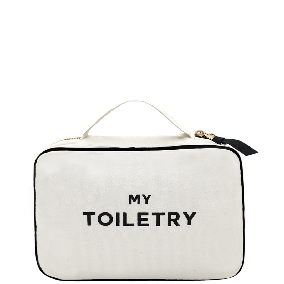 Bag-all Folding/Hanging Toiletry Case in cream with black text 'MY TOILETRY', featuring three compartments, hanging ribbon, and handle for travel organization