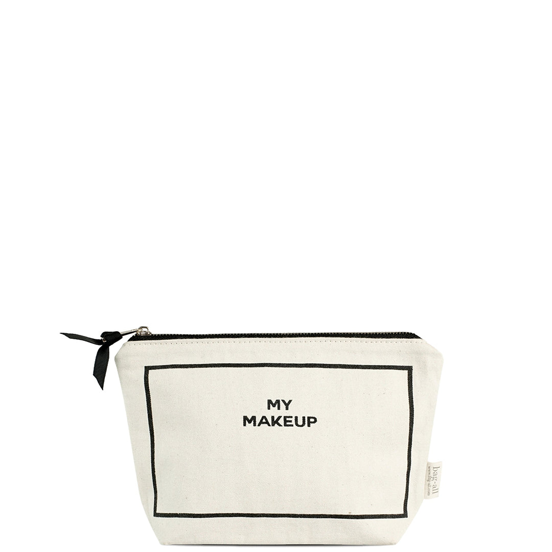 Bag-all My Makeup Pouch in cream canvas with black border trim, waterproof coated lining, zipper closure and bow detail - perfect sized beauty organizer