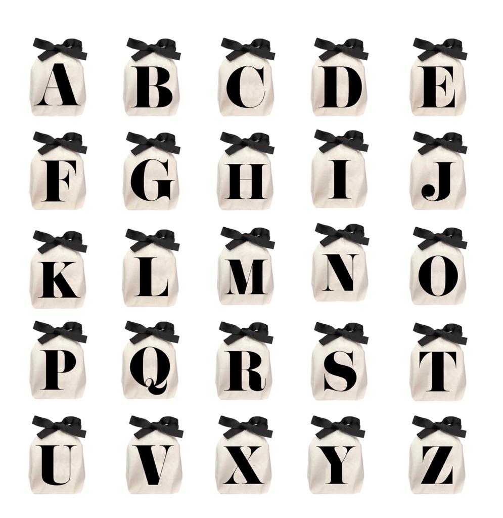 Bag-all Small Letter Bags Classic in cream with black alphabet letters A-Z, featuring elegant black bow ties, perfect for organizing small items and personalized storage solutions