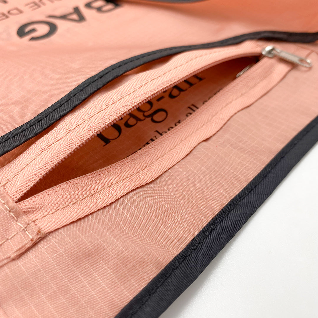 Bag-all Folding Shopping Bag with Zipper Pocket Pouch in pink and black nylon, featuring detailed close-up of reinforced zipper design and durable ripstop fabric texture, showcasing premium craftsmanship and eco-friendly construction