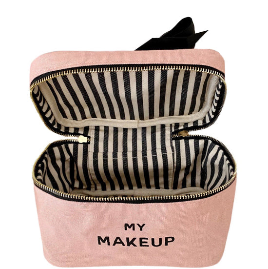 Bag-all My Makeup Cosmetic Box in blush pink with black bow, striped interior lining, gold zipper, perfect for organizing beauty essentials